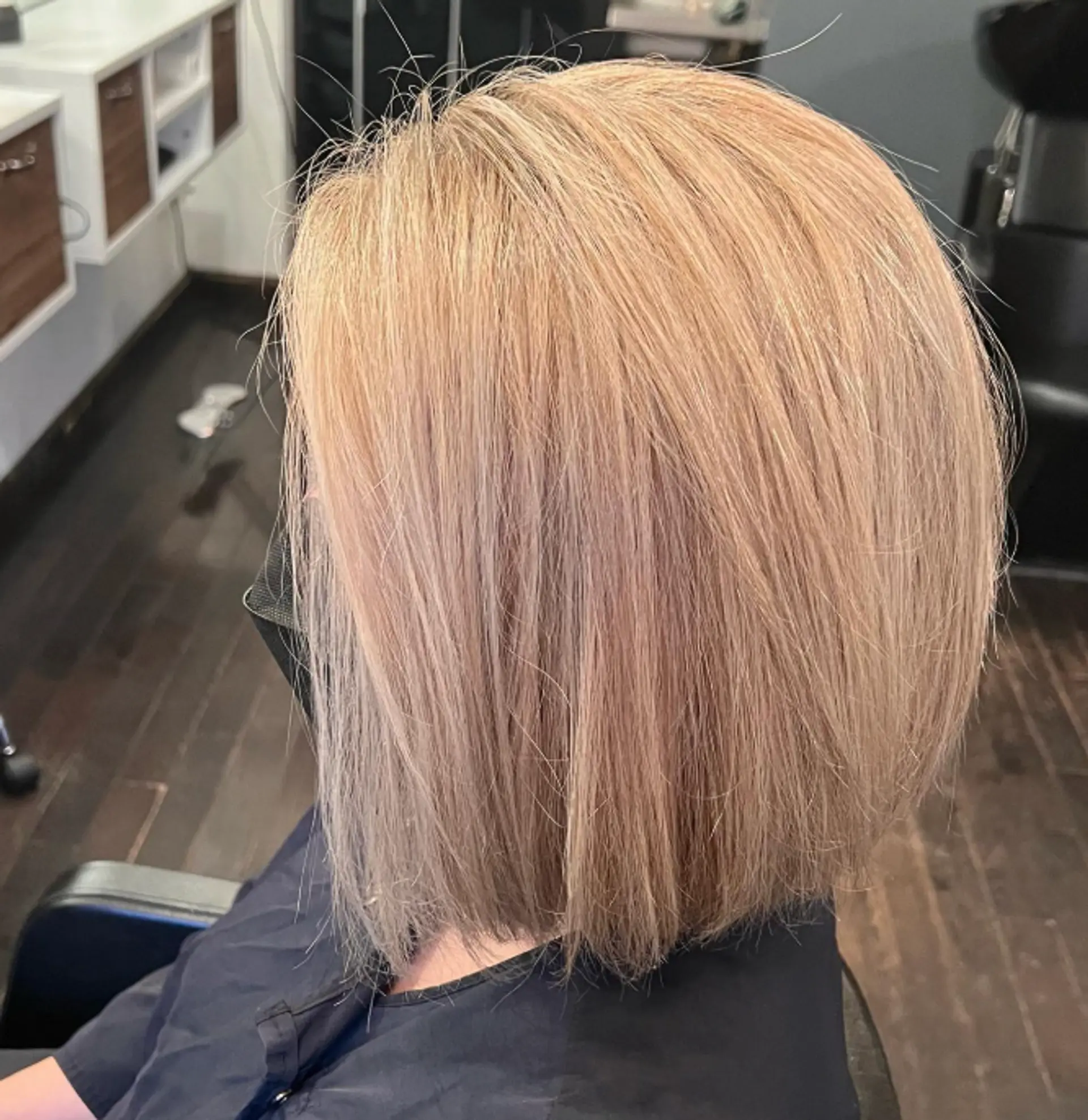 A blunt bob haircut with a straight, even length all around. 1