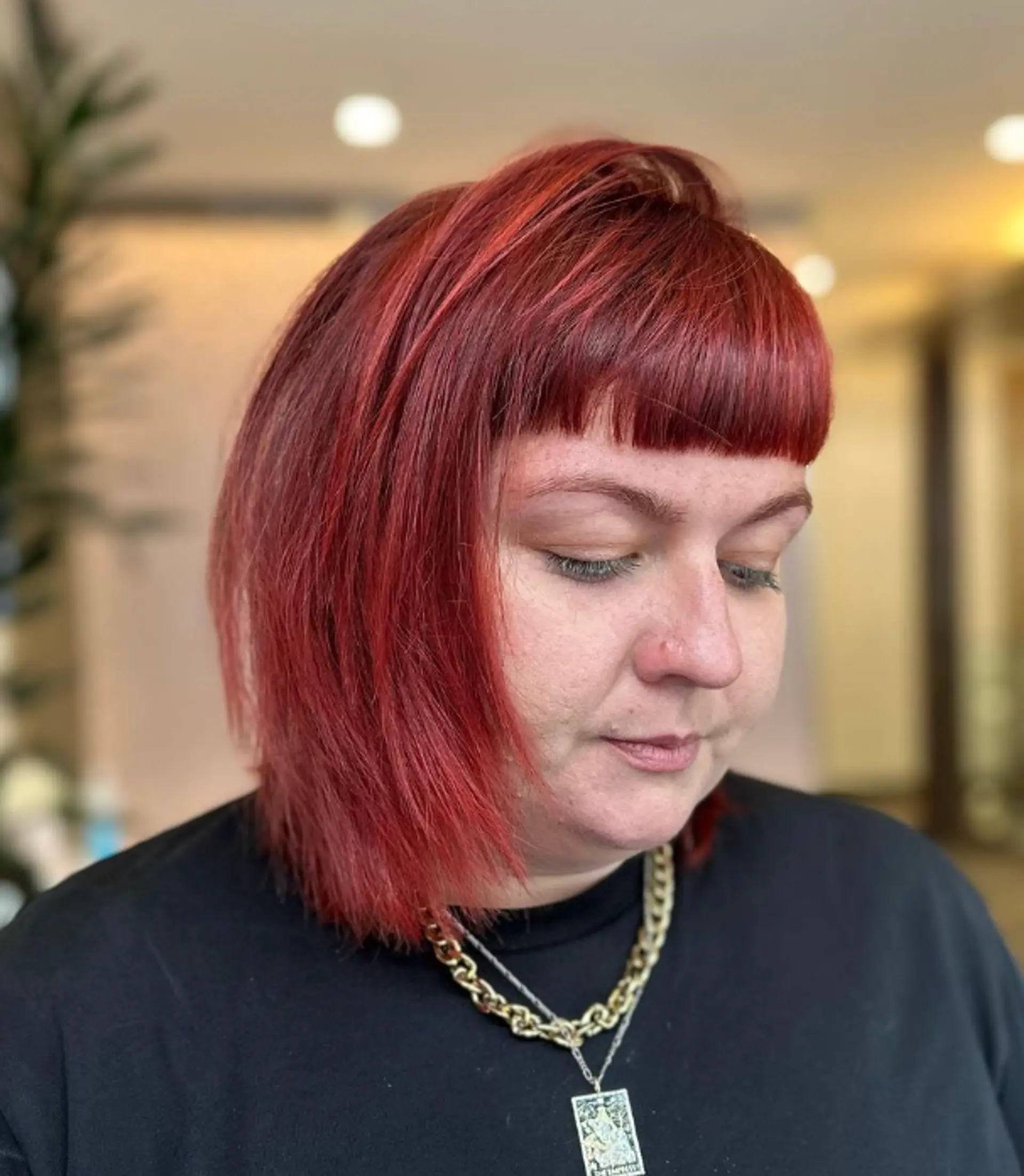 Vibrant red, medium-length bob with straight texture, blunt bangs, sharp angled cuts, and textured layers.

Color by @simabeautynyc
Cut and style by @juliamannino_hair
 1
