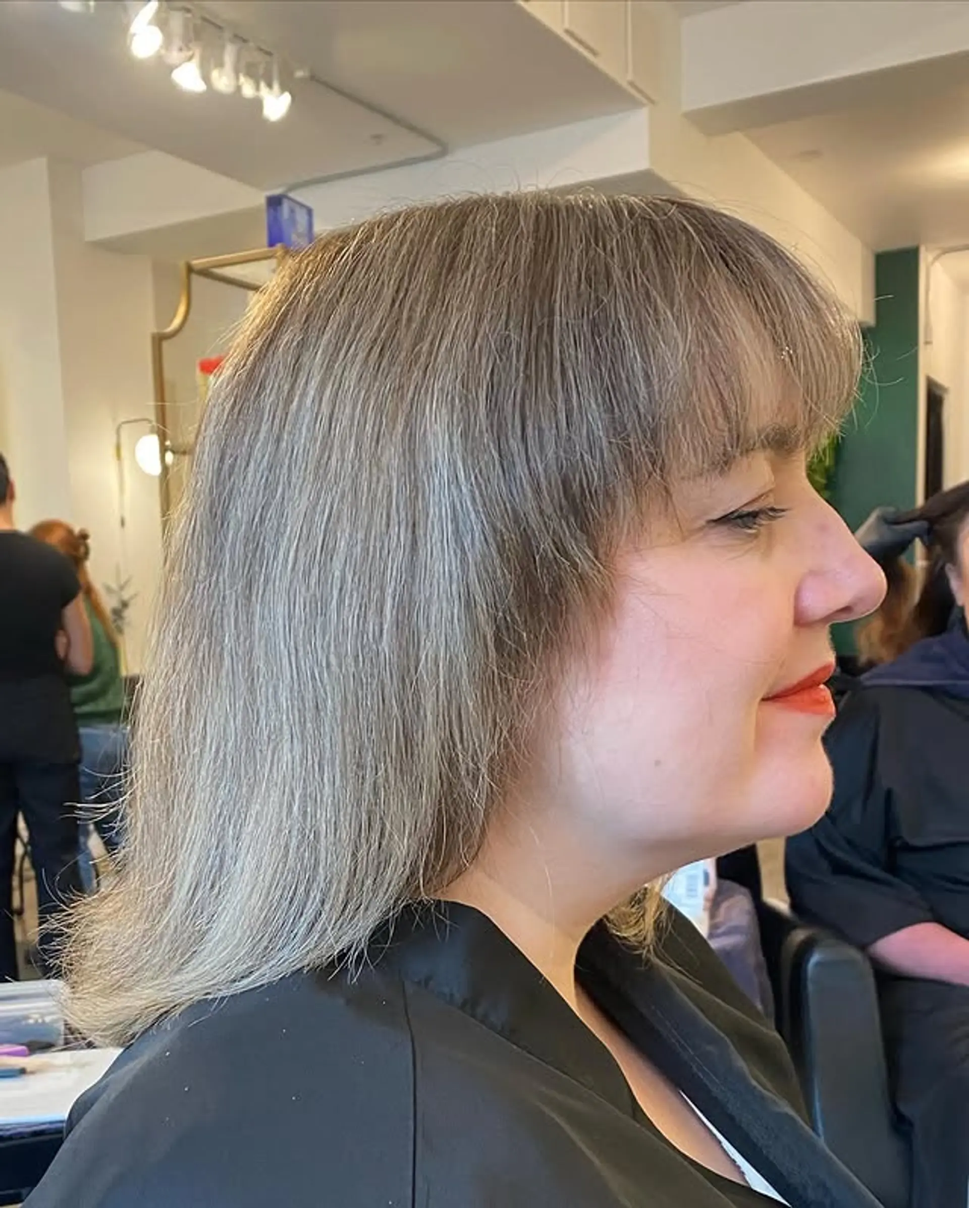 A textured lob (long bob) with straight hair and flattering bangs. 1