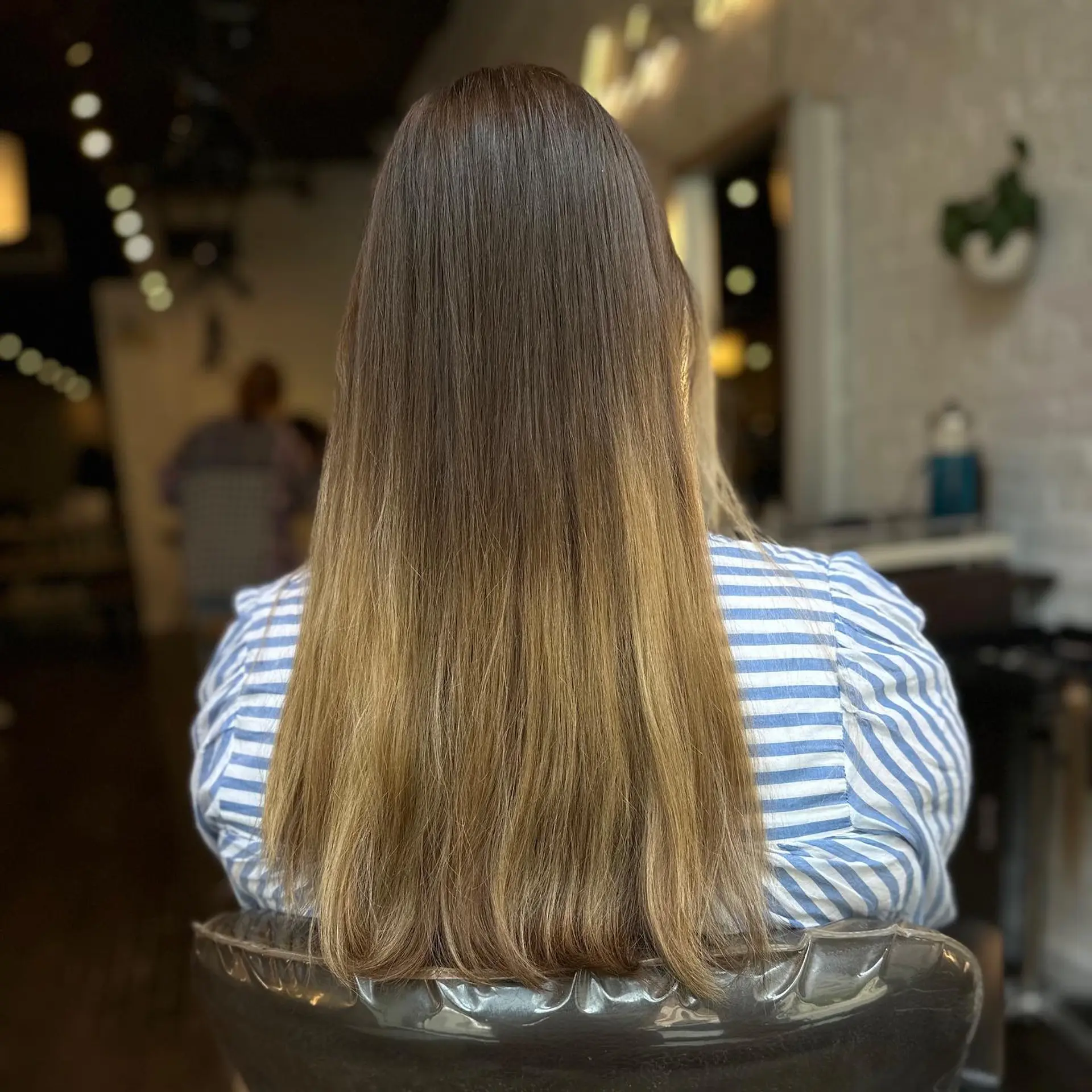 A bronde lob (long bob) with loose beach waves for an effortless, chic look. 3