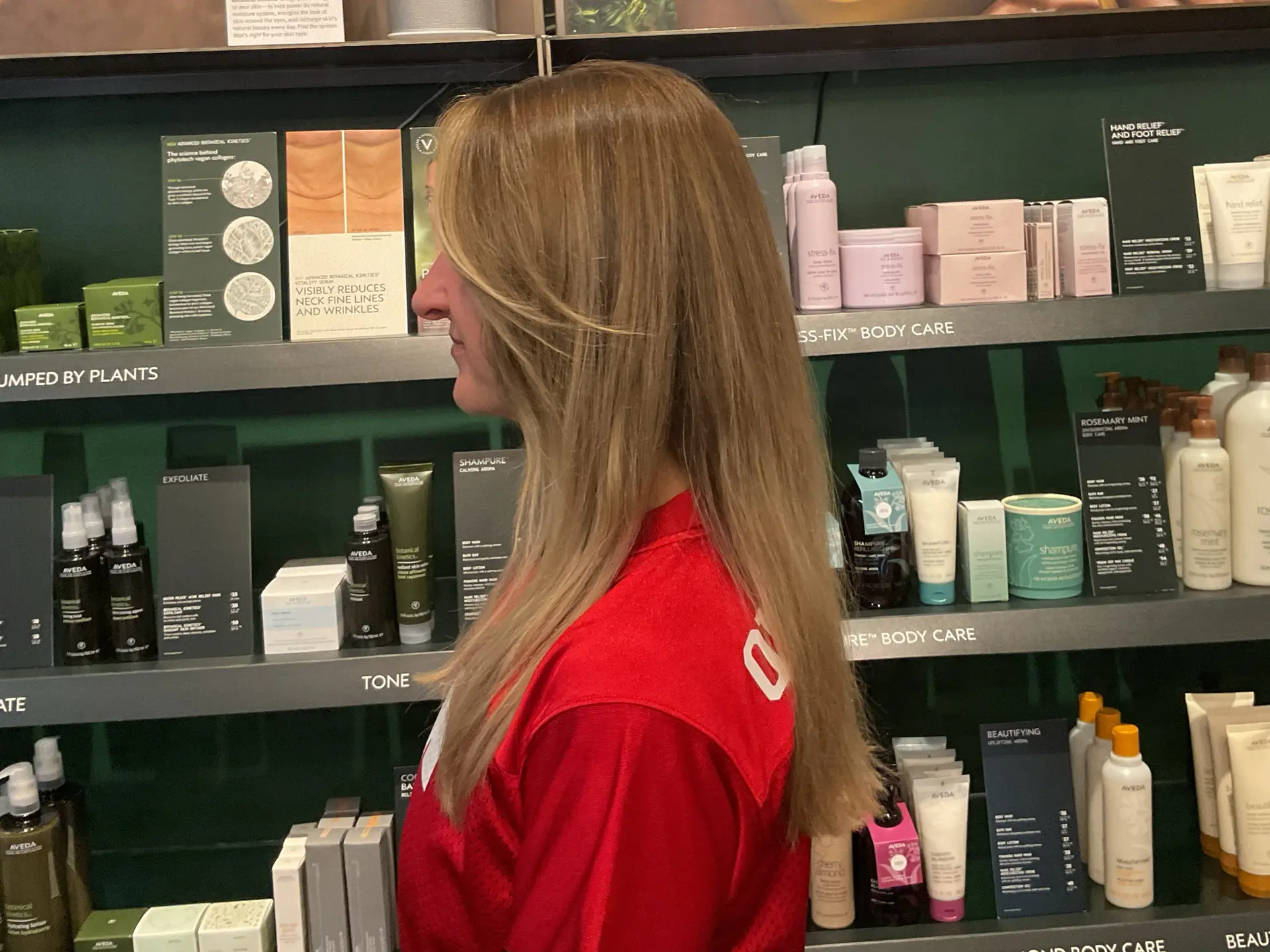Long, straight dark blonde hair styled smoothly with gentle face-framing curtain layers. 1