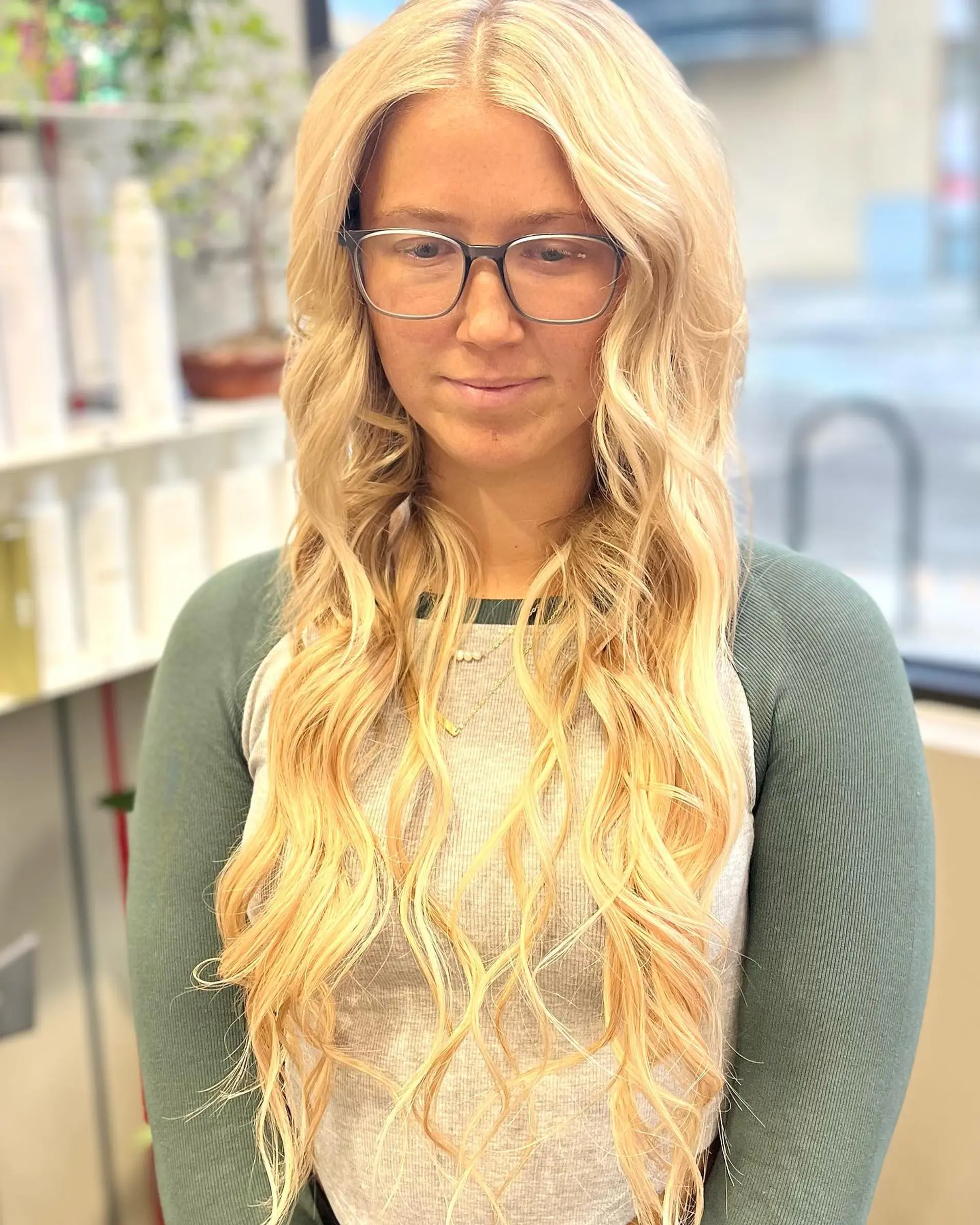 Long blonde hair styled into soft, beachy waves. 2