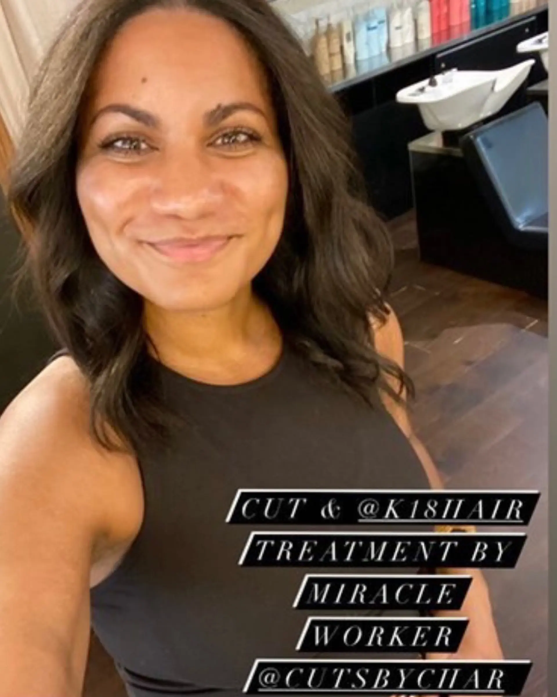 A medium-length cut finished with a smooth silk press and gentle face-framing waves. 1