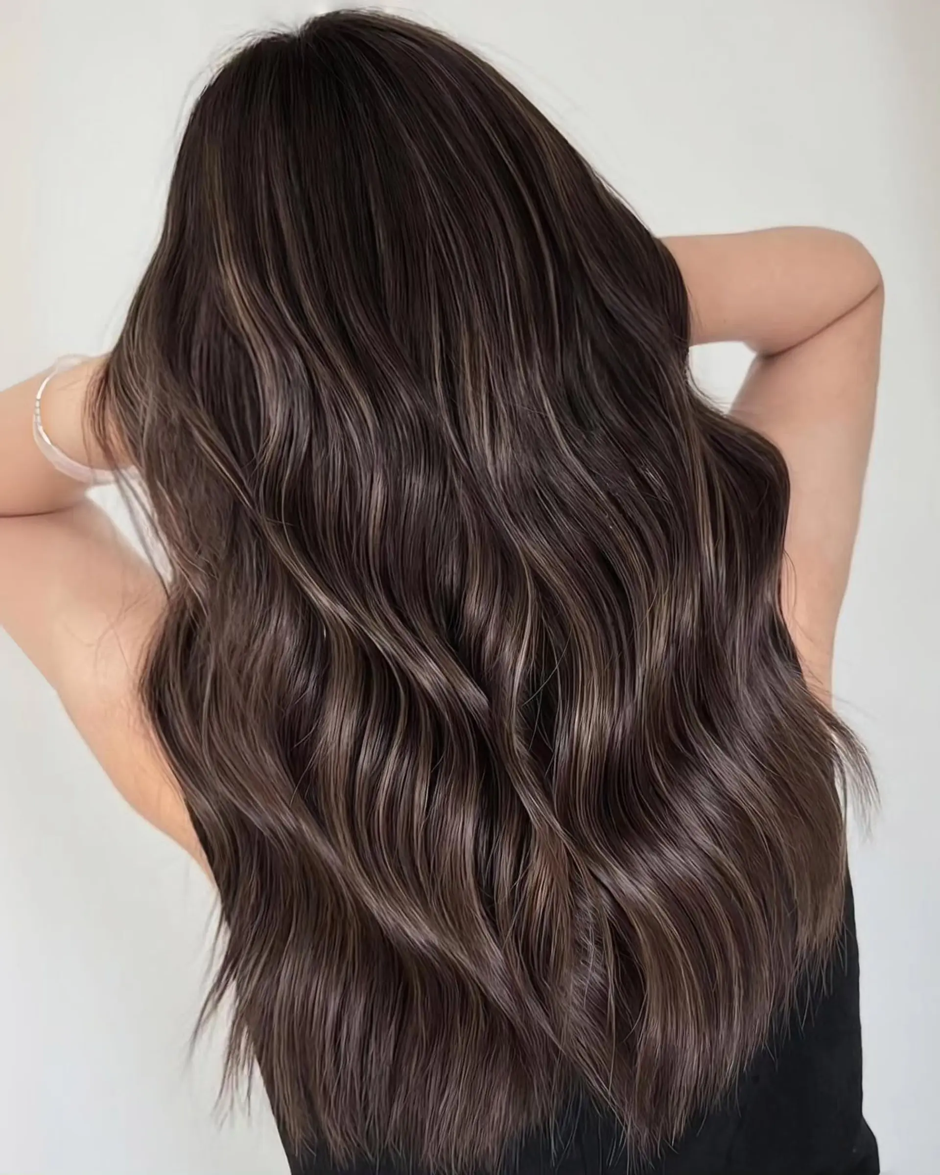 Long hair with soft, wavy styling and ash brown balayage highlights. 1