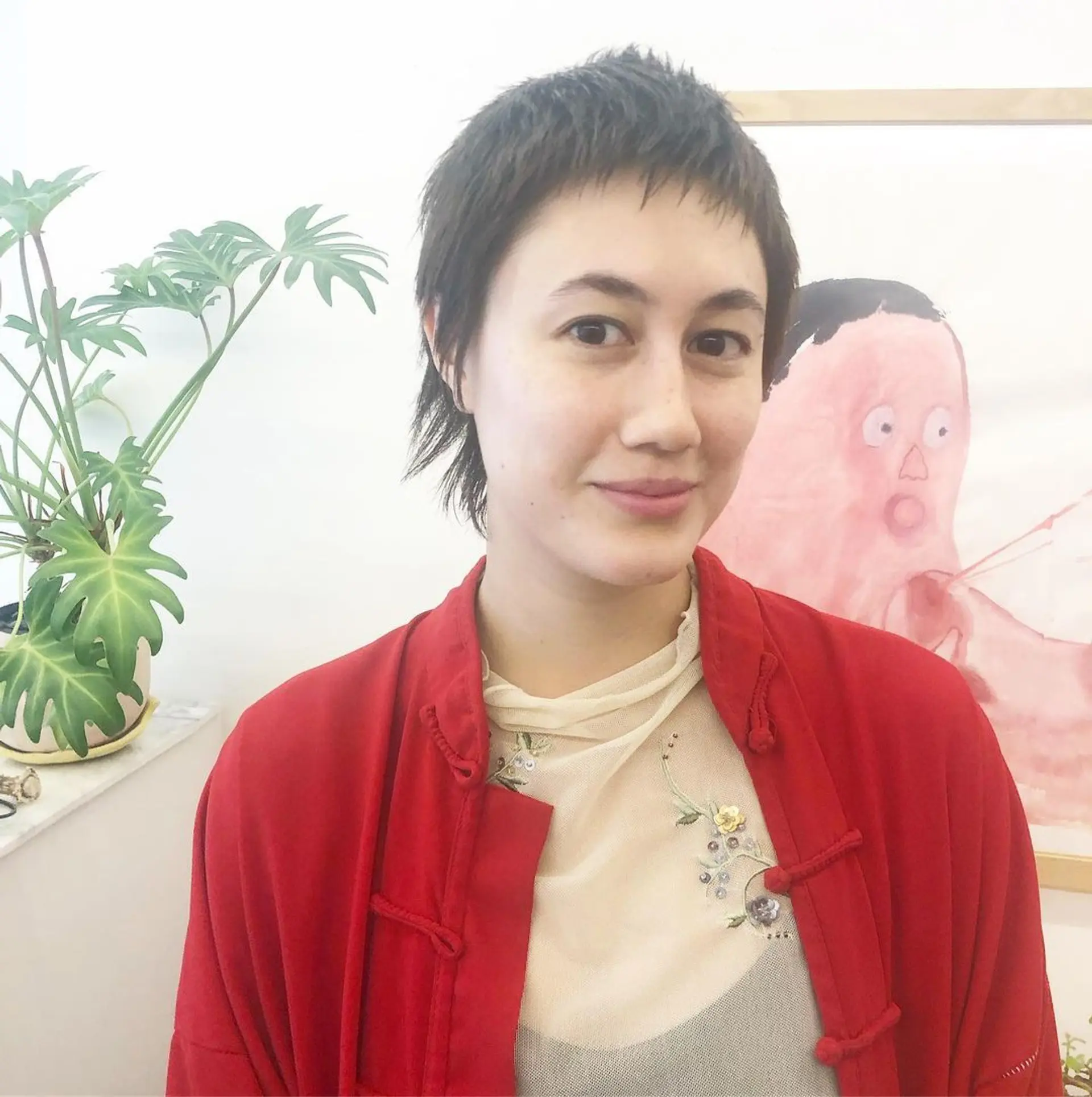 Short, textured pixie cut with tapered back and fringe detailing, combining black and dark brown colors by Takeo. 1