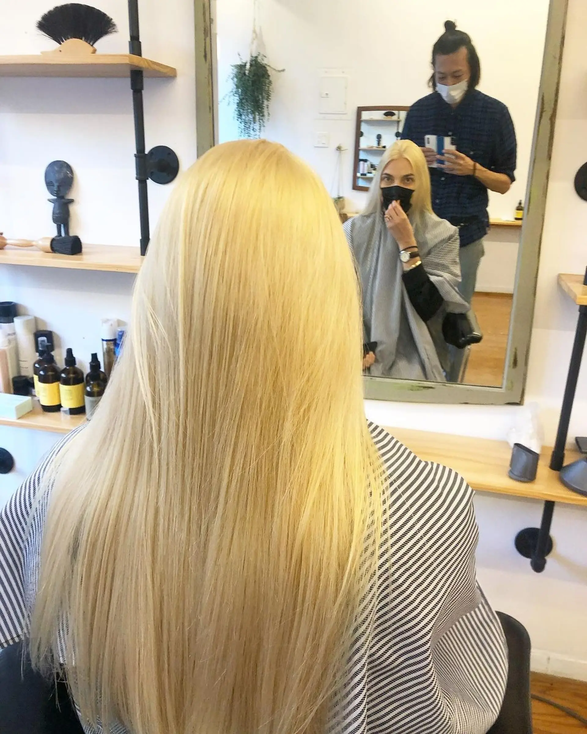 A sleek, straight, and very long platinum blonde hairstyle with a smooth and silky texture. One time bleach, with toner, took 3 hours by @ takeohair 1