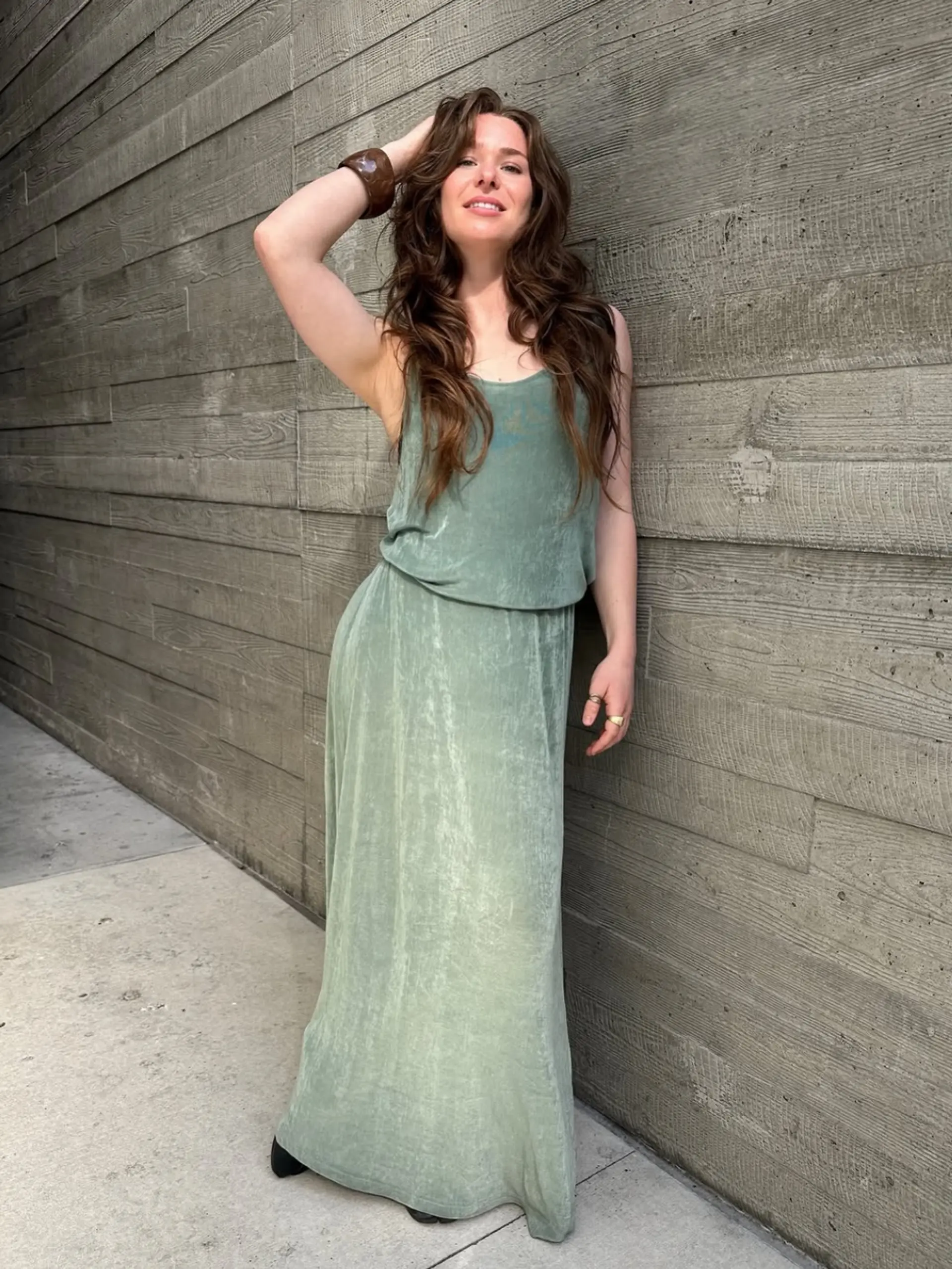 Voluminous, long layered brunette hair styled with soft, cascading waves. 1