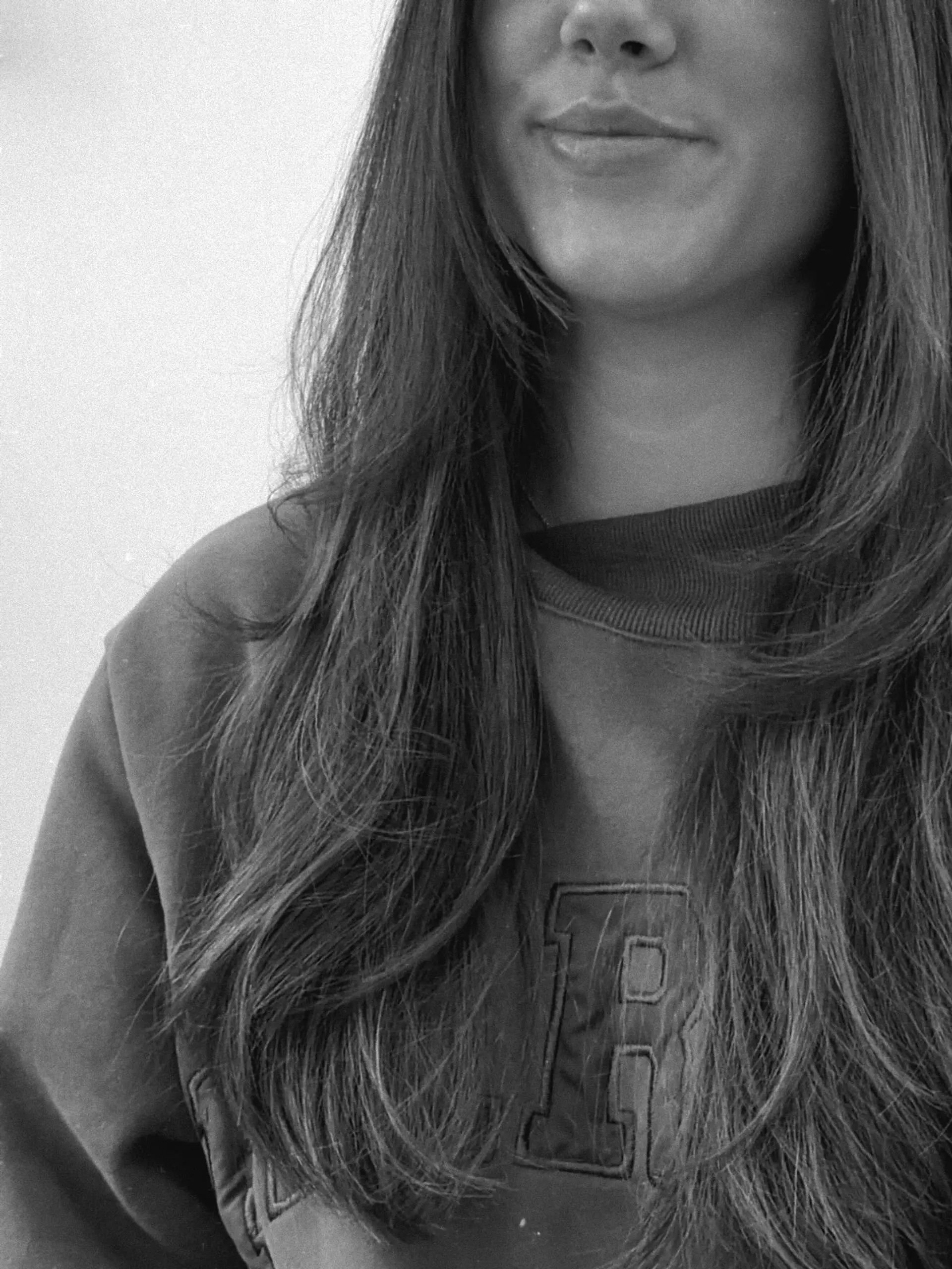 Long hair featuring soft, face-framing layers and a smooth, textured blowout finish. 1
