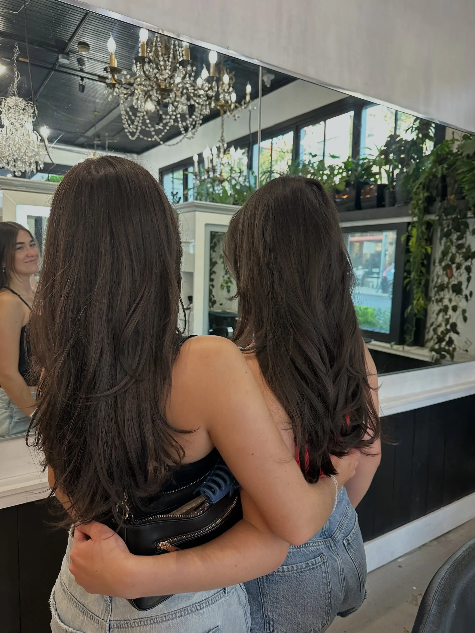 Long dark brown hair styled with soft, flowing layers and subtle flipped ends from a blowout. 1