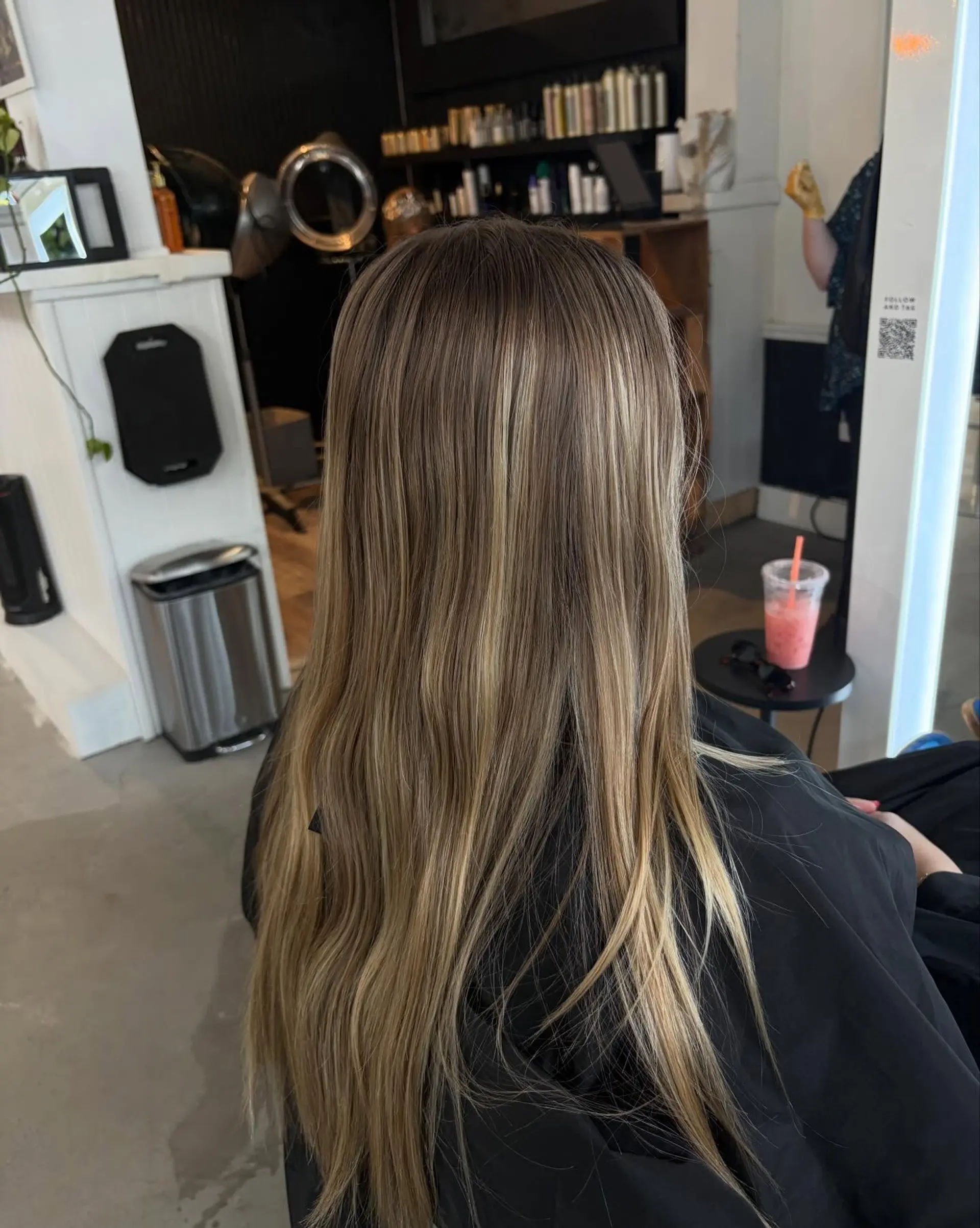 Long straight hair highlighted with fine, seamless dimensional blonde foils over a natural light brown base. 1
