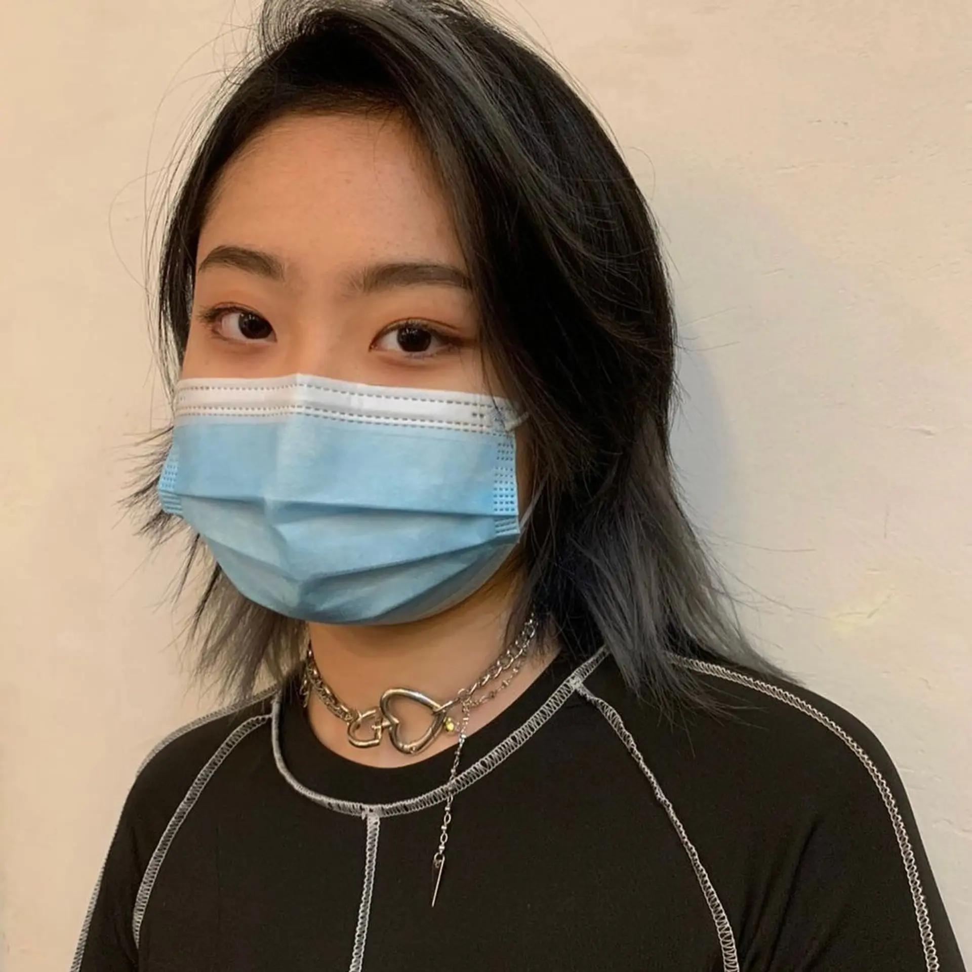 A medium-length edgy layered wolf cut with straight black hair accented by bold gray highlights. It features uneven layers and jagged ends for a voluminous and textured appearance. (Hair by Nori) 3