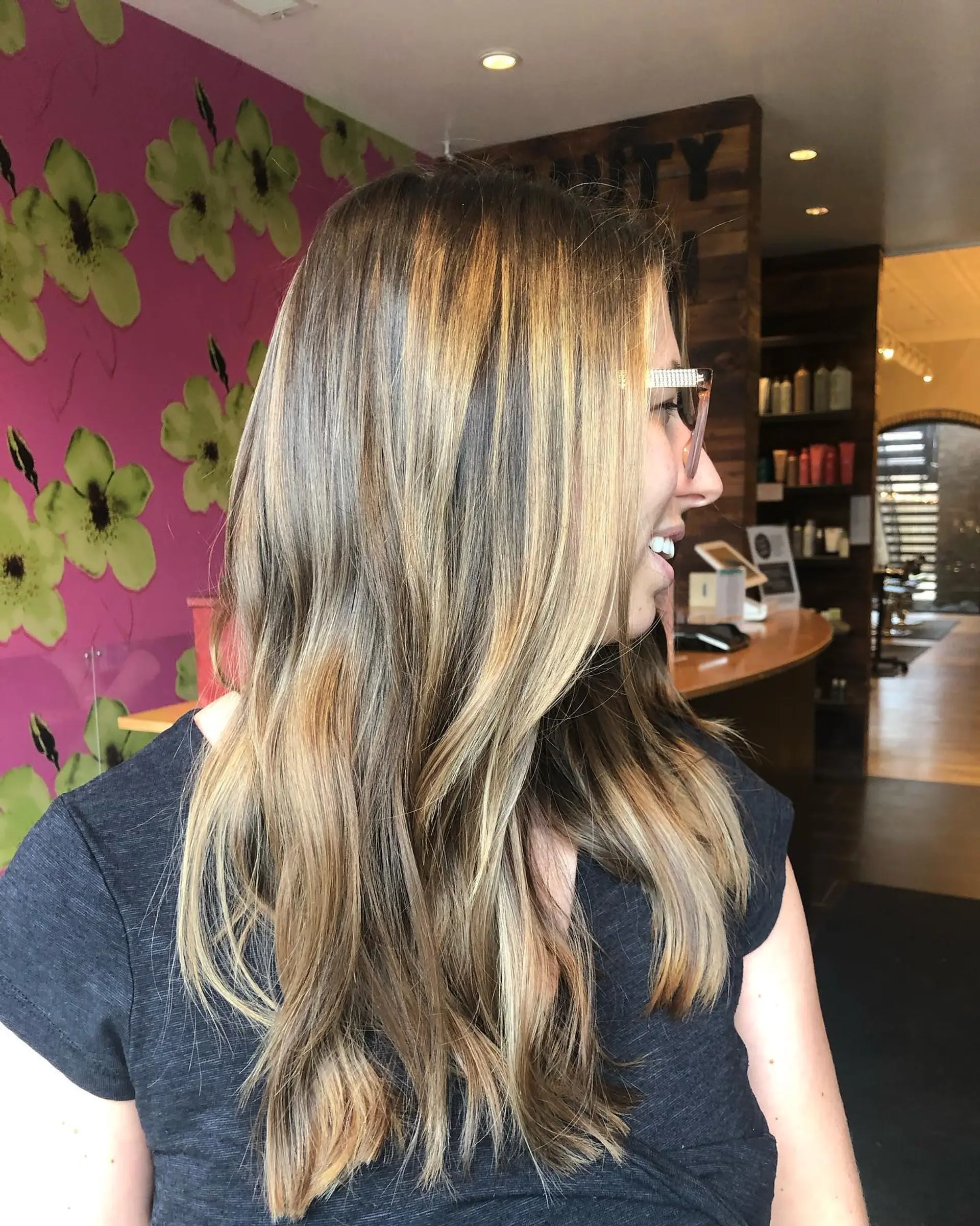 Long, wavy hairstyle with caramel ribbon highlights. 2