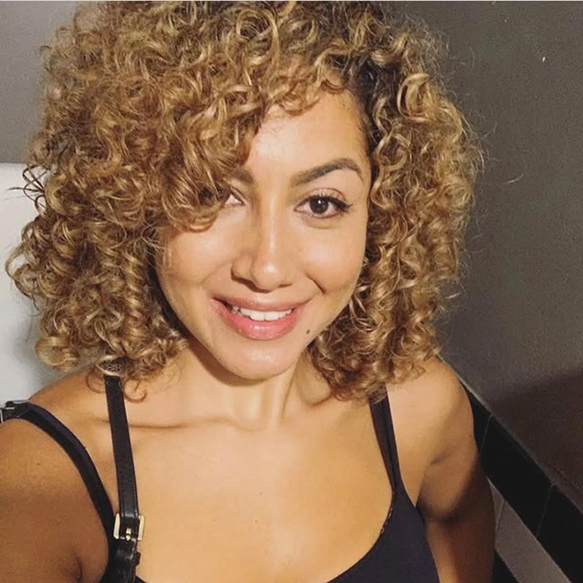 A glamorous voluminous curly bronde bob with gold leaf accents. - Preview 2