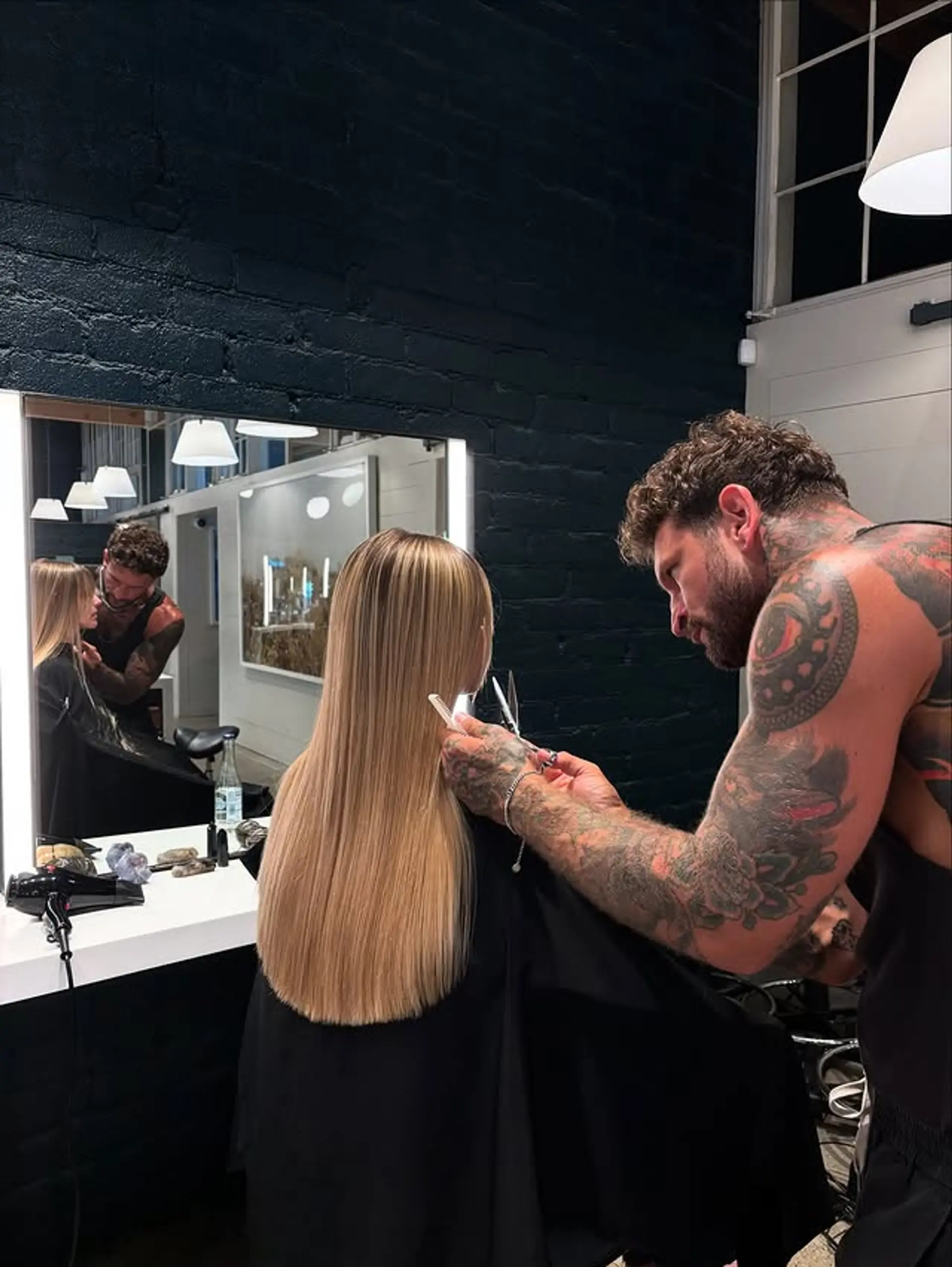 A long, straight hairstyle with a blunt cut. 1