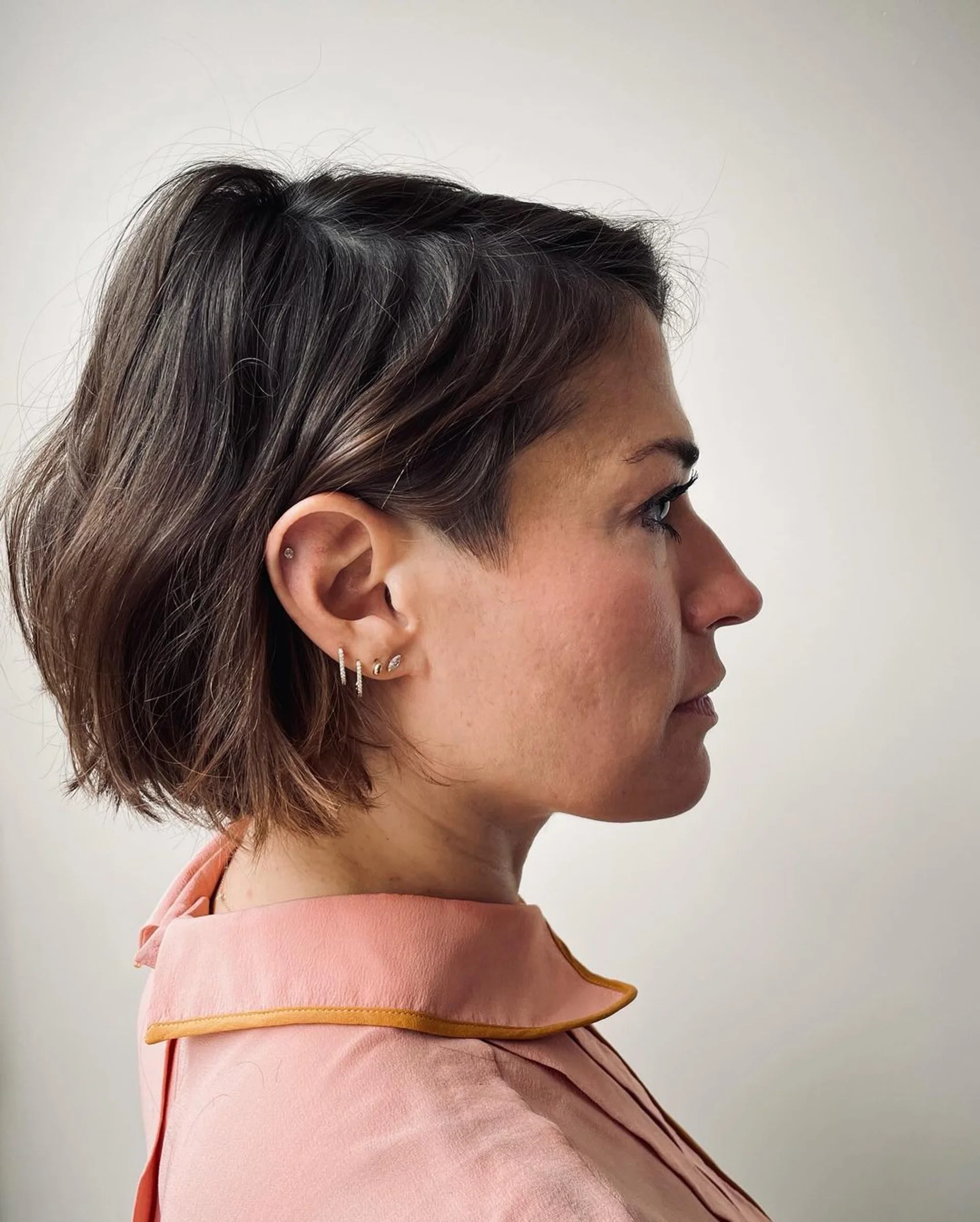 A woman with a sleek, chin-length Summer Bob haircut, a popular low-maintenance style in NYC for 2025. - Preview 2