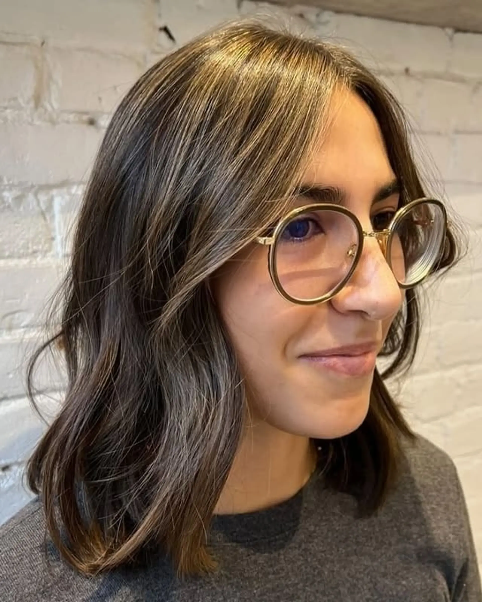 A trendy shoulder-length lob with a bronzed balayage and soft face-framing layers. 1