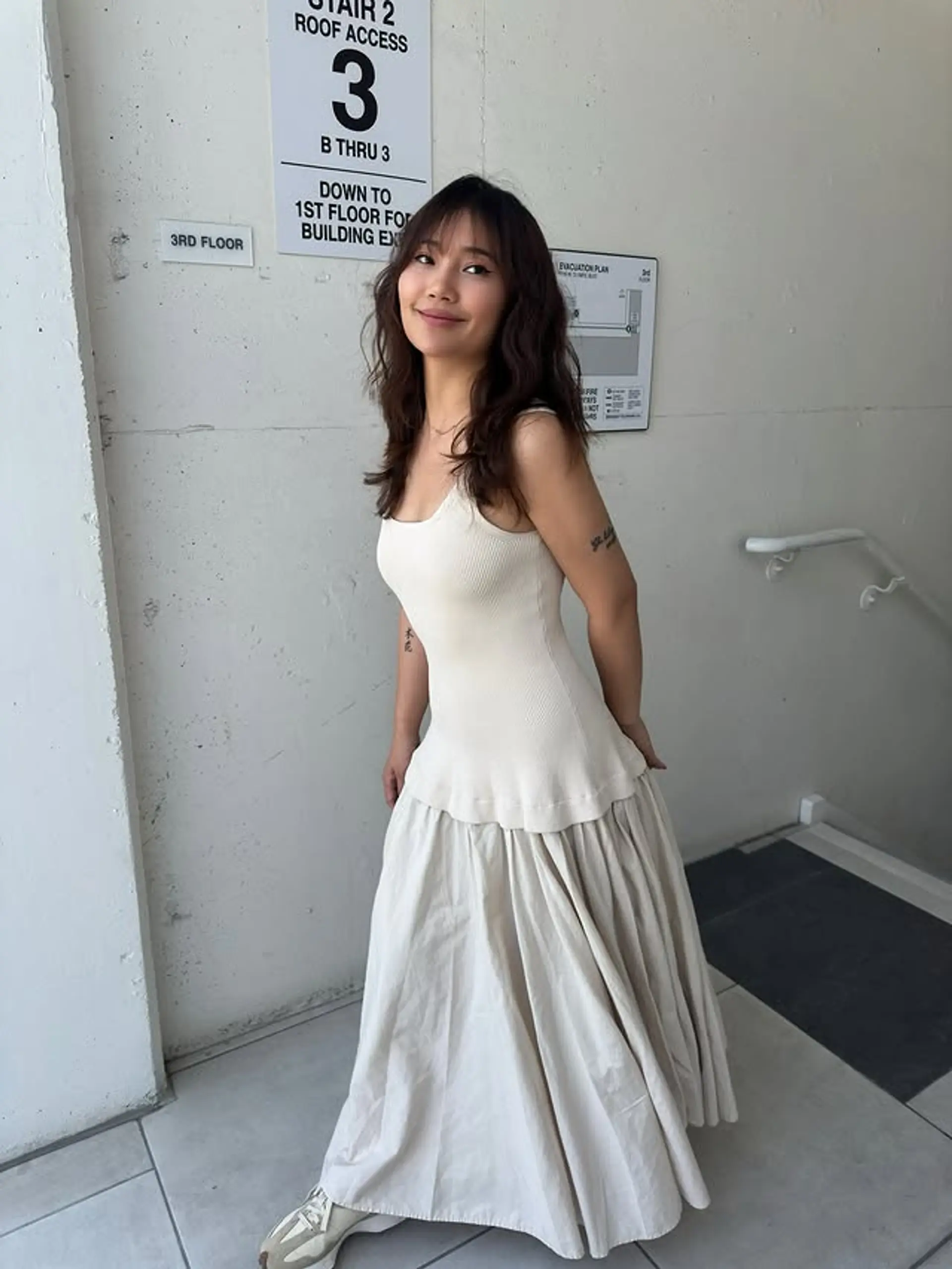 A textured, medium-length shag haircut with face-framing layers and choppy bangs. 1