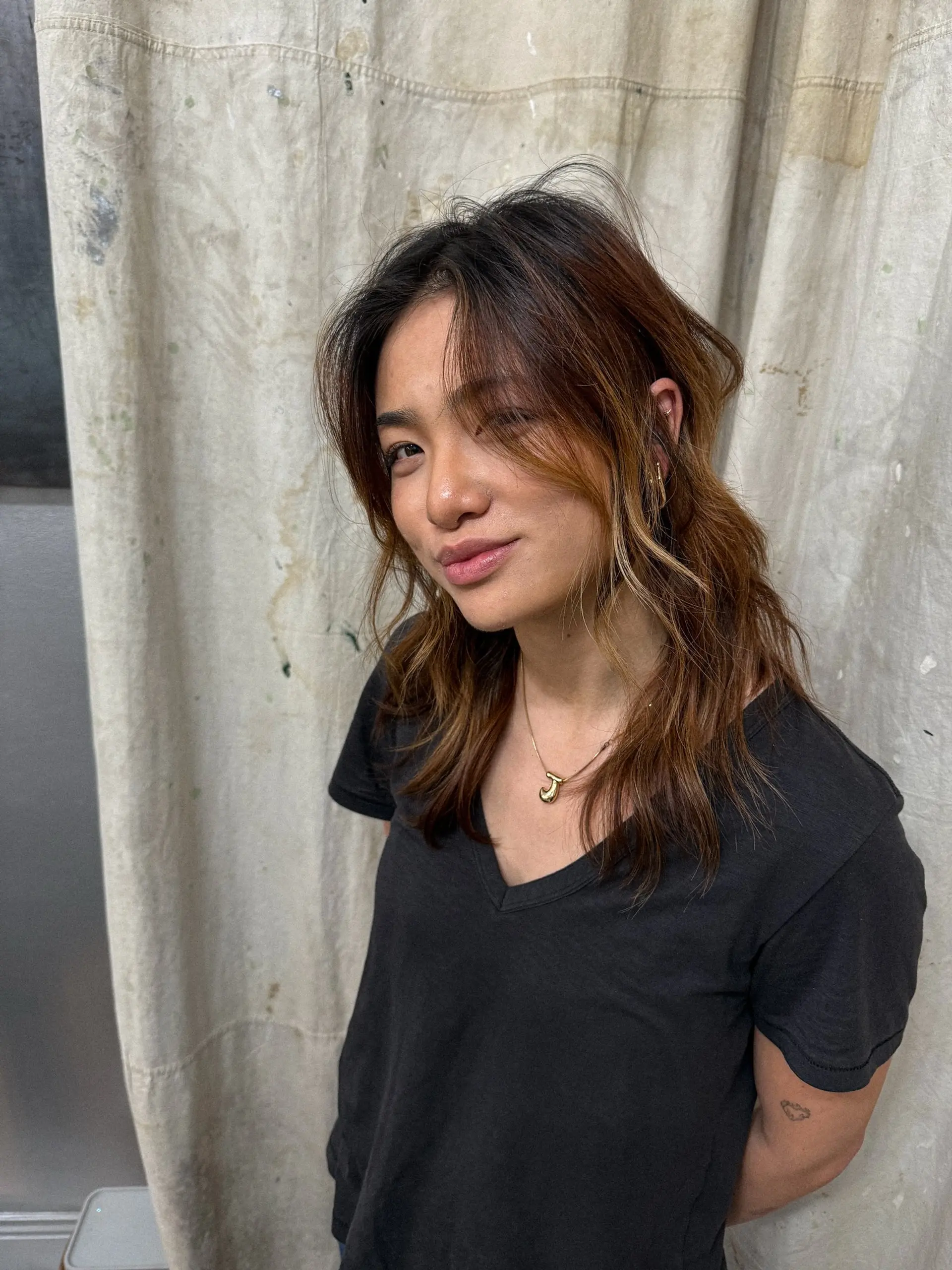 A medium-length shag with layers and balayage highlights. 4