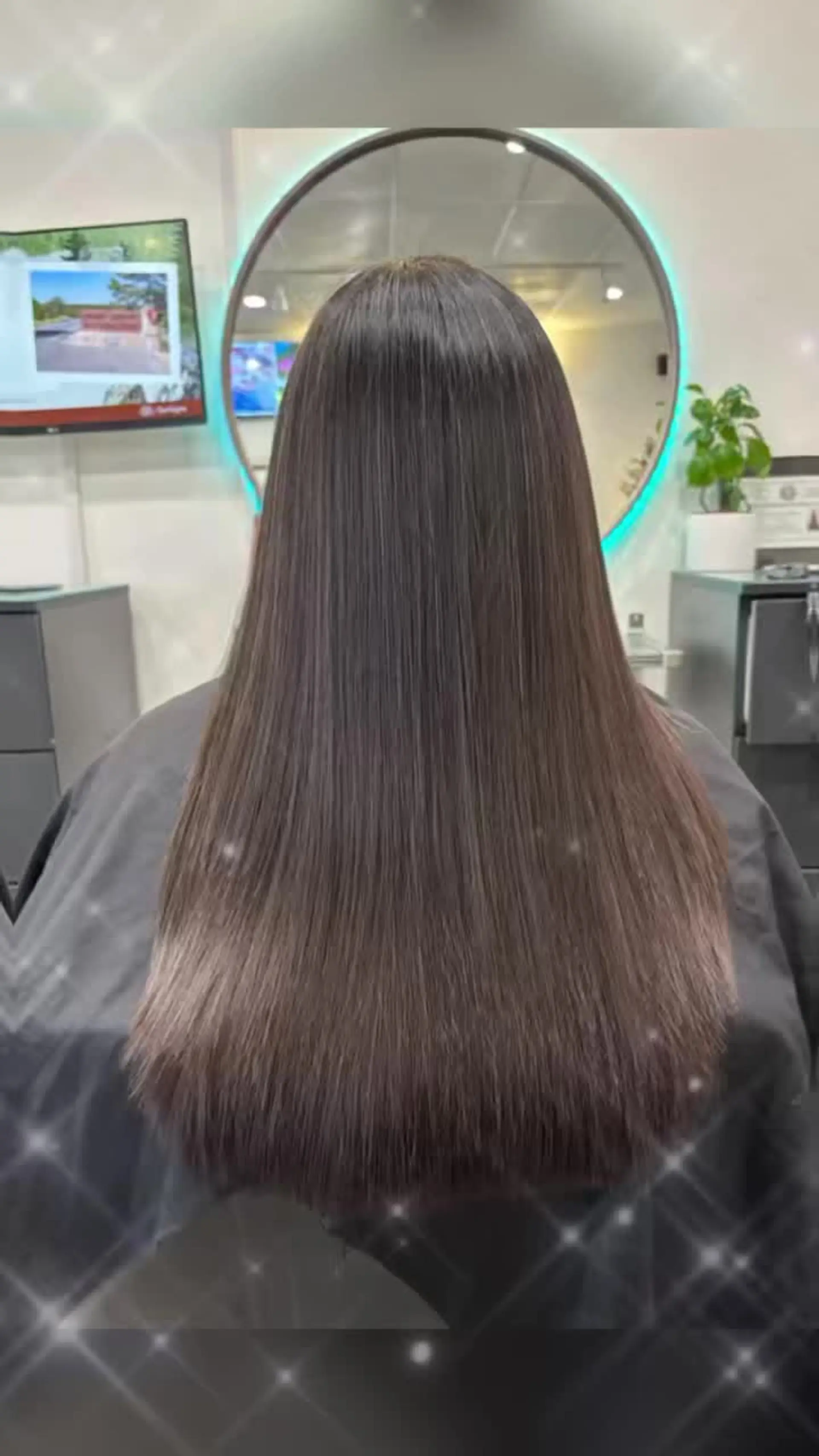 Ultra-smooth, glossy dark brown hair styled pin-straight with a mirror-like shine. 1