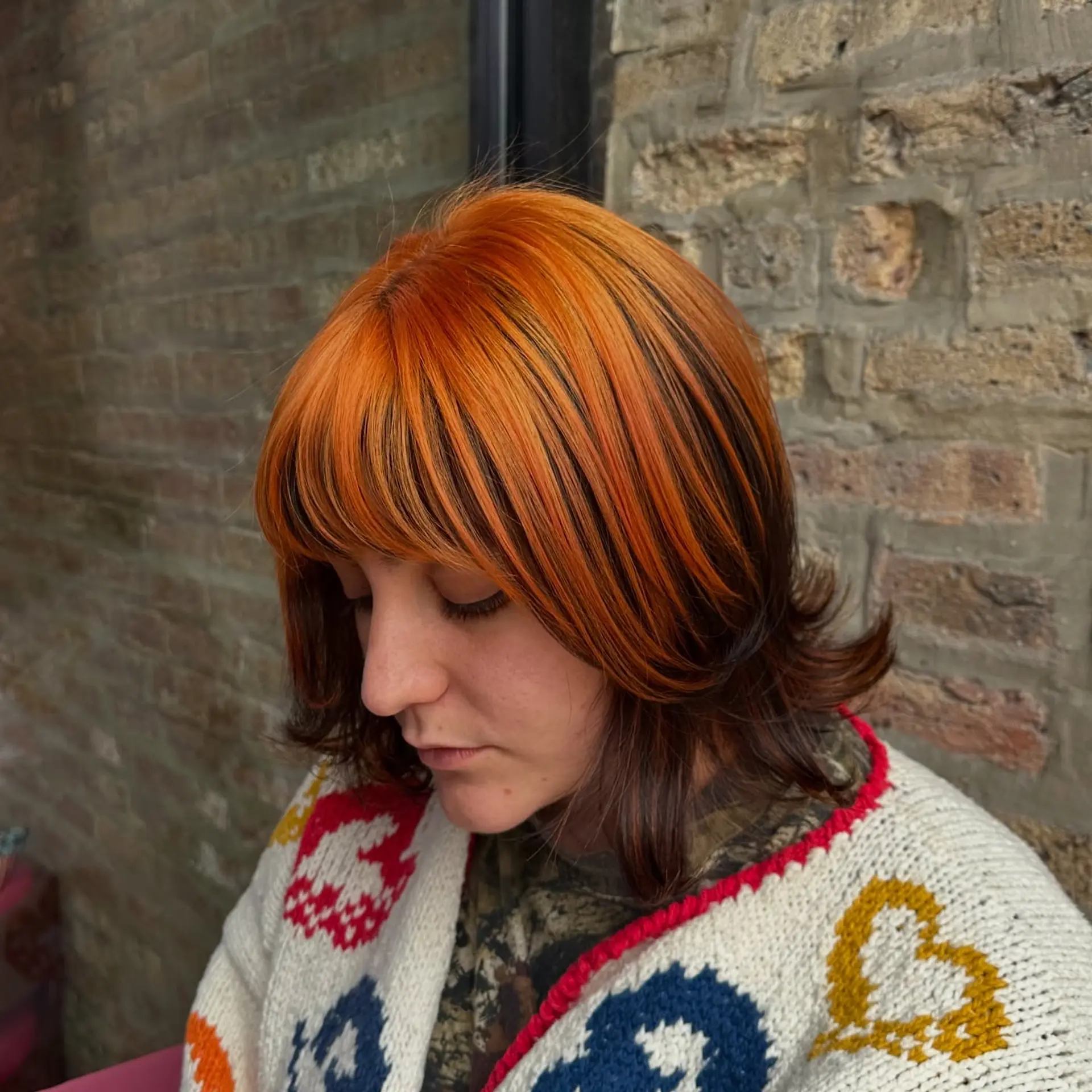 A trendy layered bob with copper balayage highlights. 2