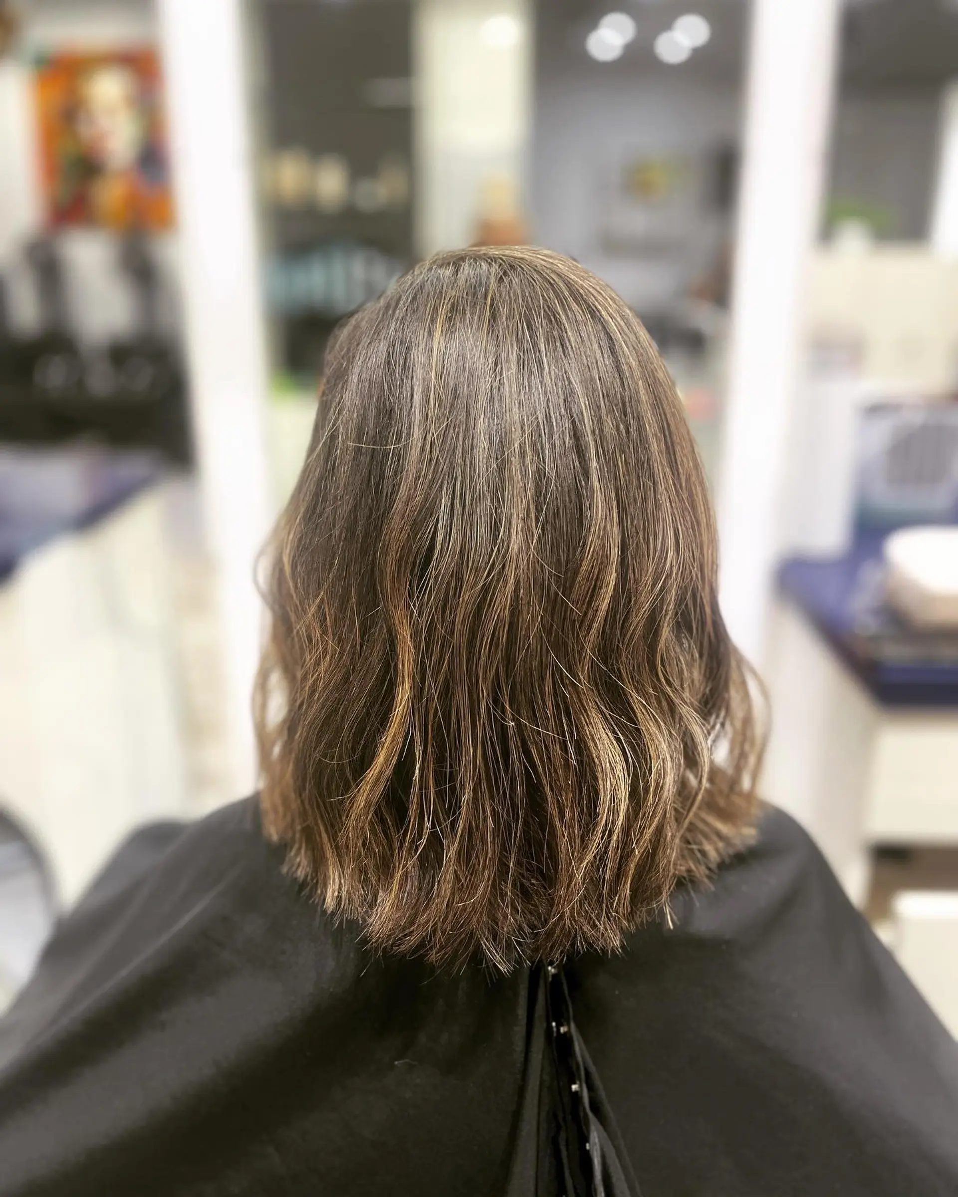 A medium-length lob with loose waves and a bronde balayage. 1