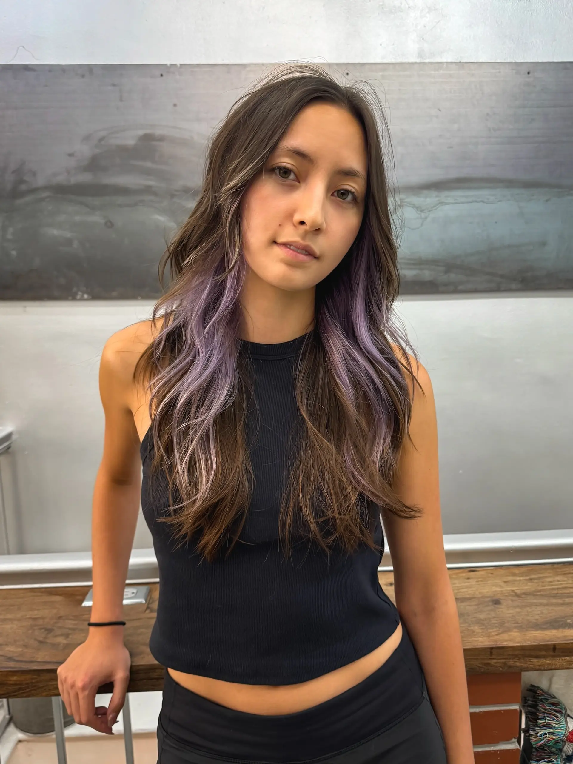 Long, wavy brunette hair with subtle face-framing lavender highlights. 1
