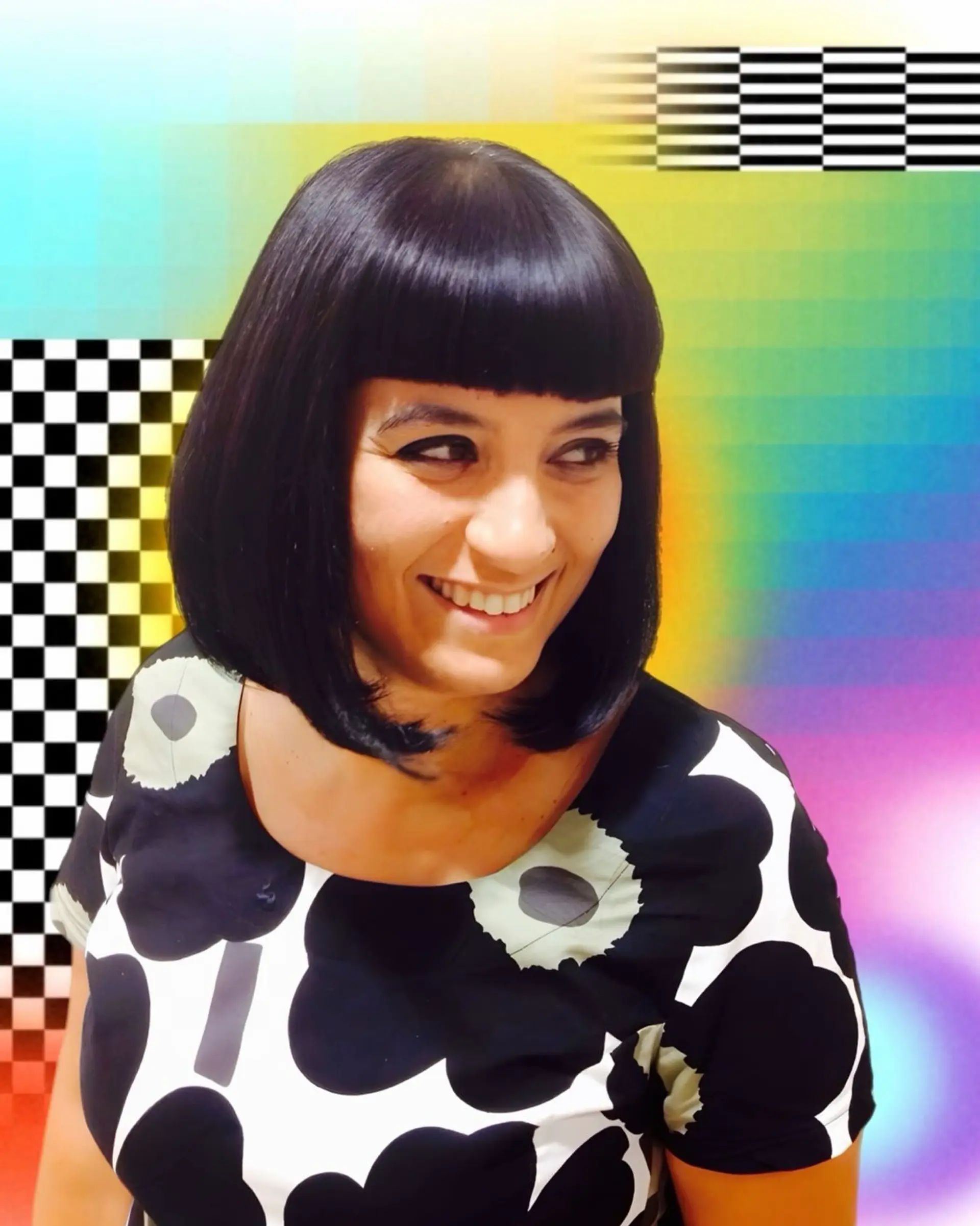 A sleek, jet-black bob cut right at the collarbone with rounded ends and sharp, blunt bangs. 1