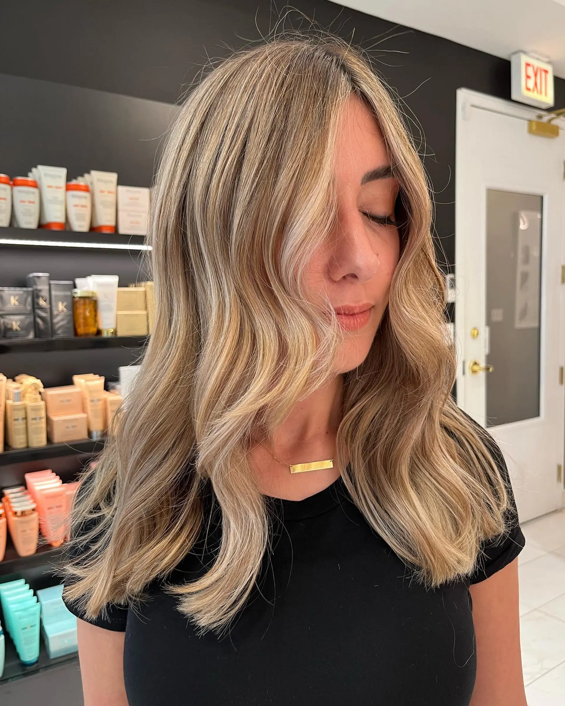 A breezy medium-length wavy hairstyle with relaxed beach waves. 1