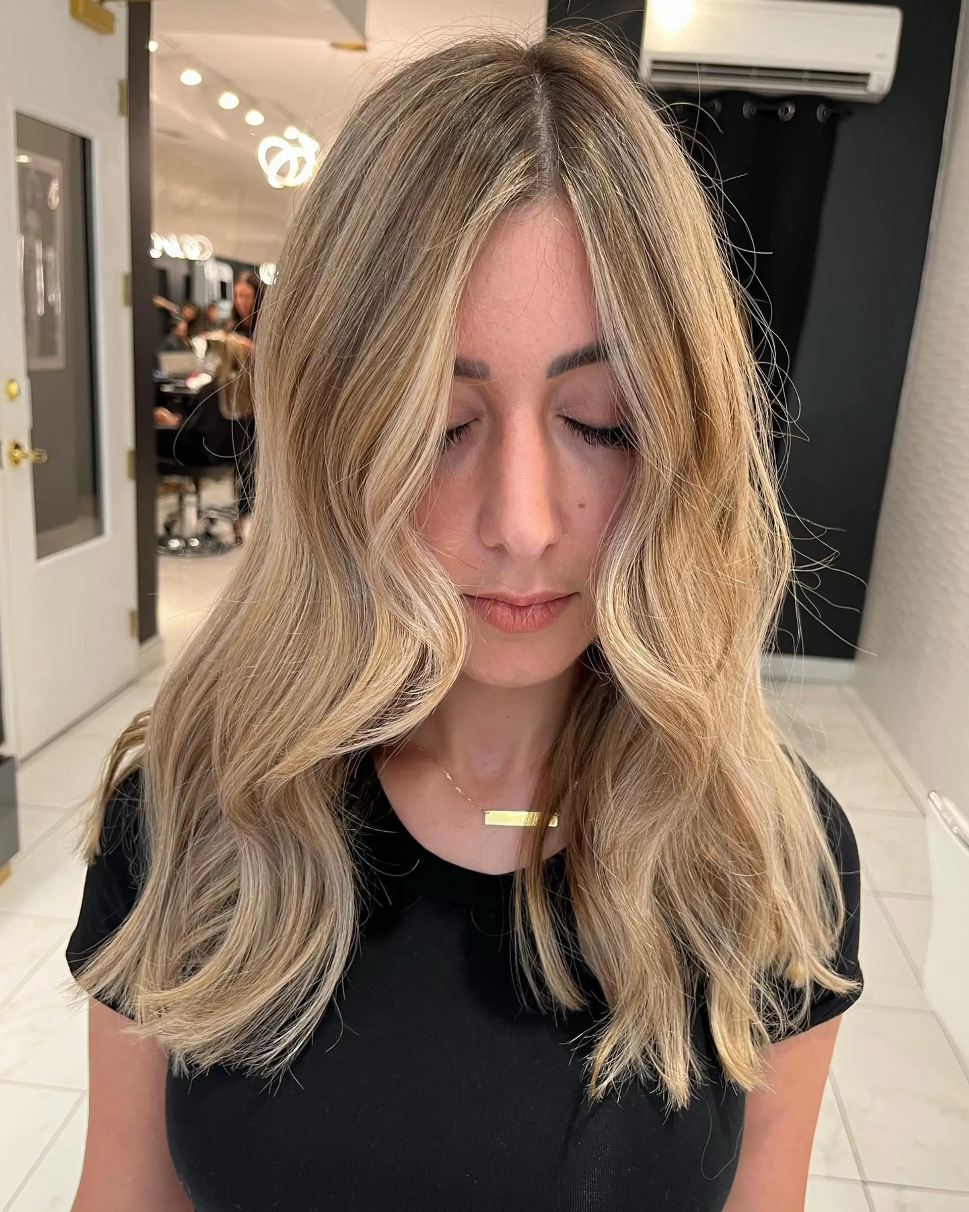 A breezy medium-length wavy hairstyle with relaxed beach waves. 3