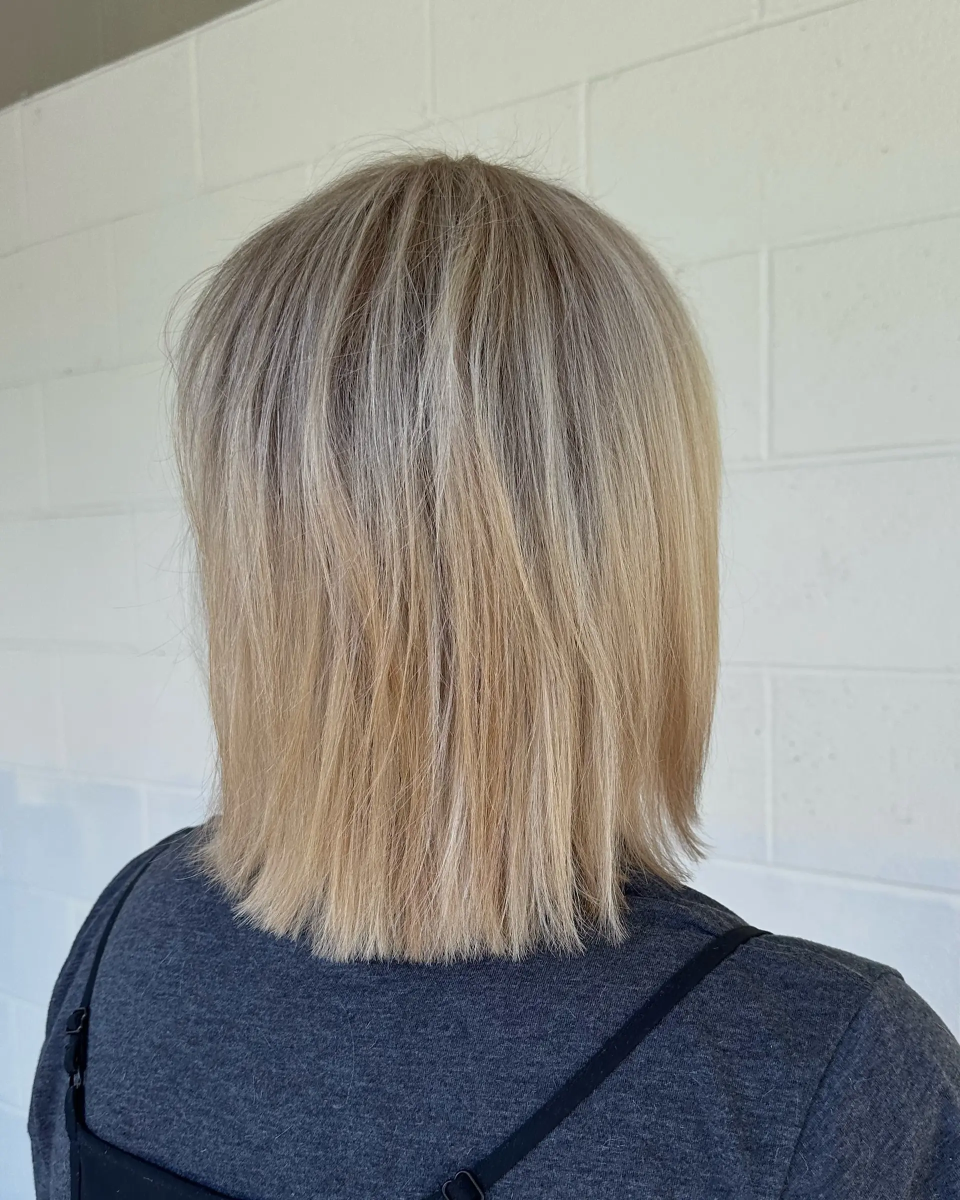A straight blonde bob cut sitting right at the shoulders with clean, blunt ends and dimensional tones. 1