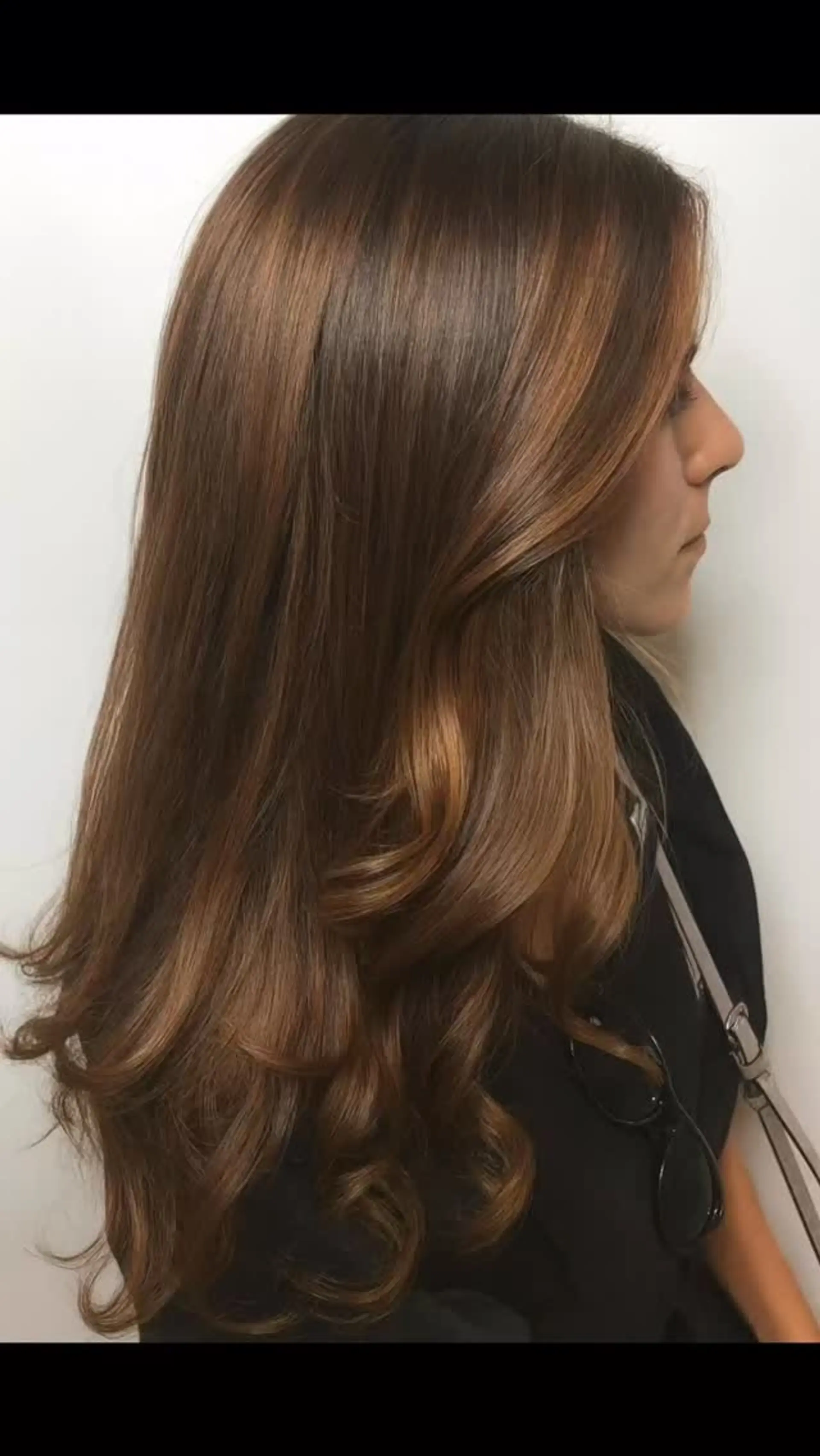 Glossy warm brunette hair with smooth volume and soft curls through the ends. 1