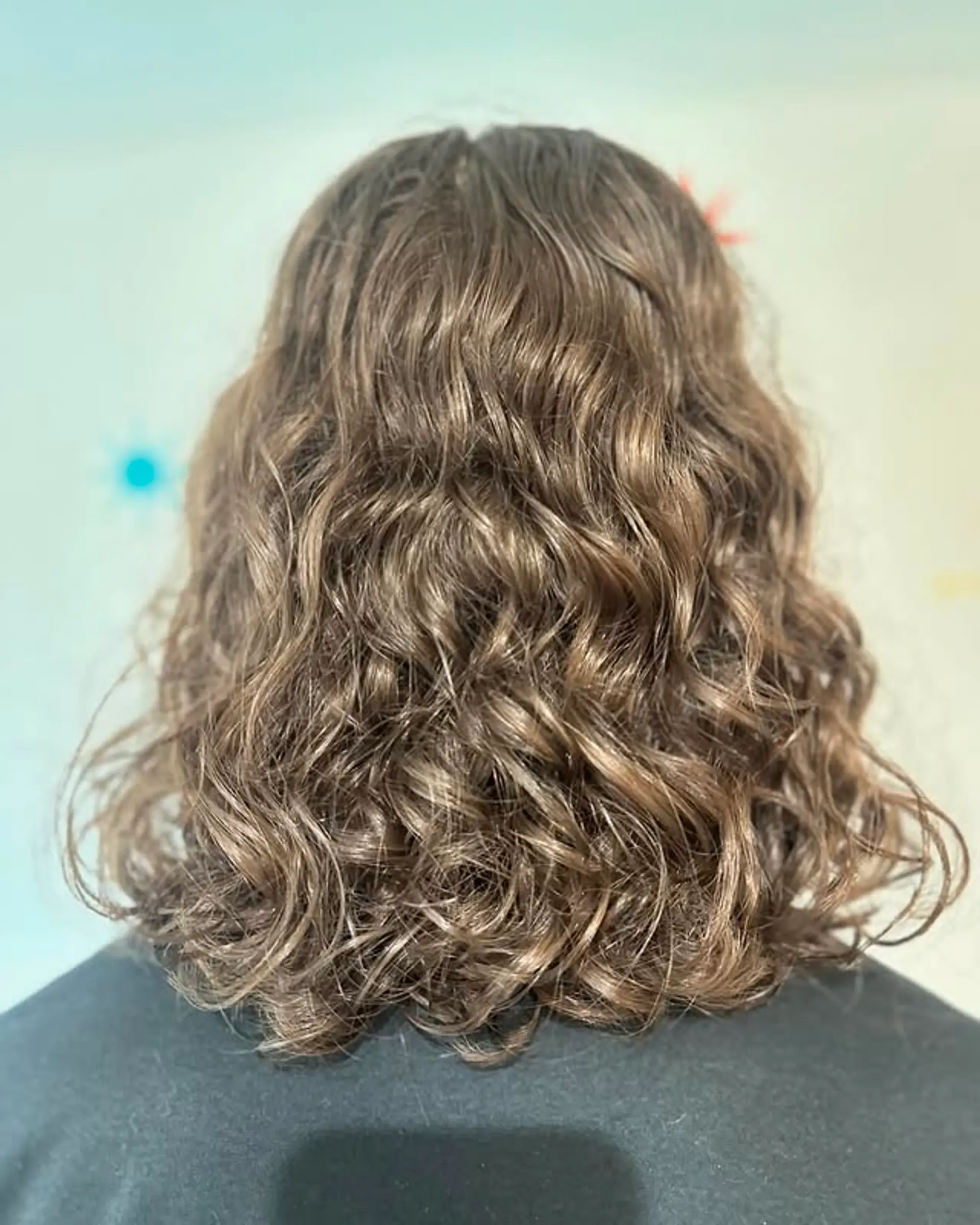 A mid-length shag with natural waves and layers. 1