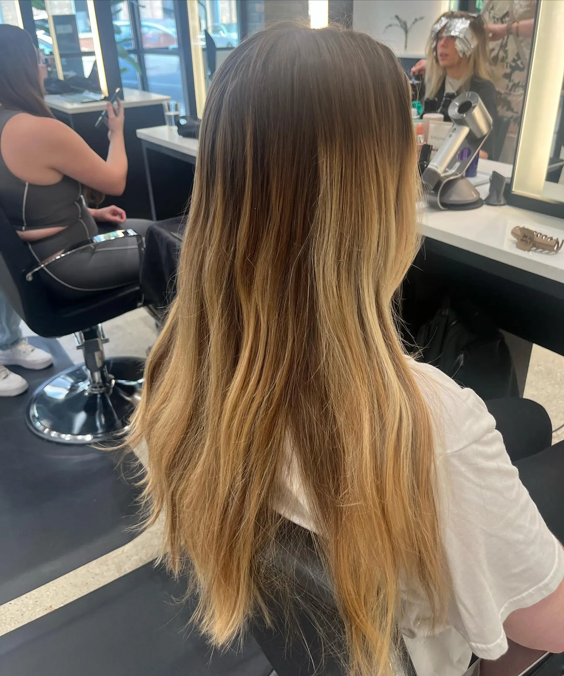 Long, wavy hair with a blonde balayage. 3