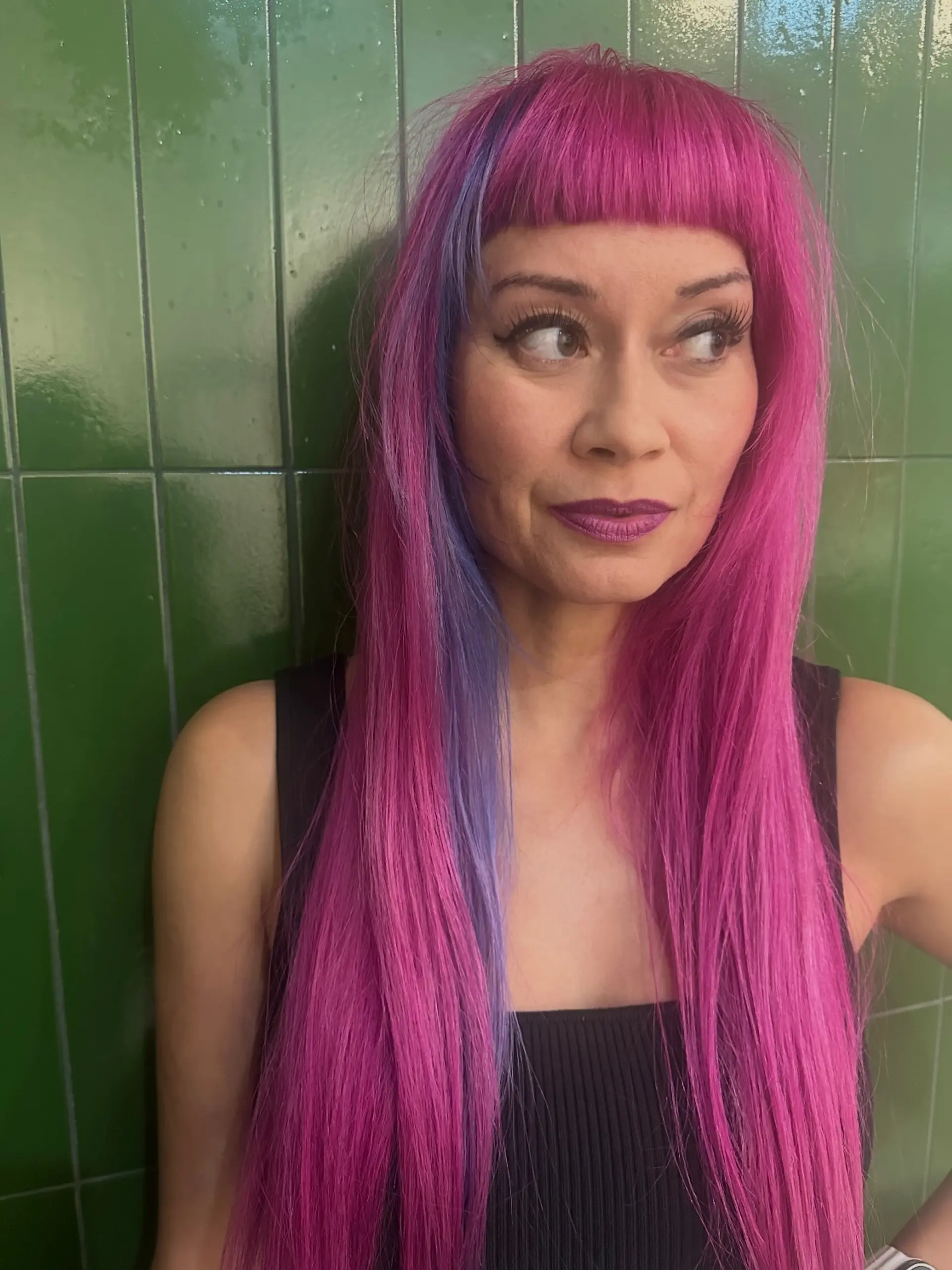 Straight, long magenta-pink hair paired with blunt micro bangs and a contrasting periwinkle blue face-framing accent streak. 1