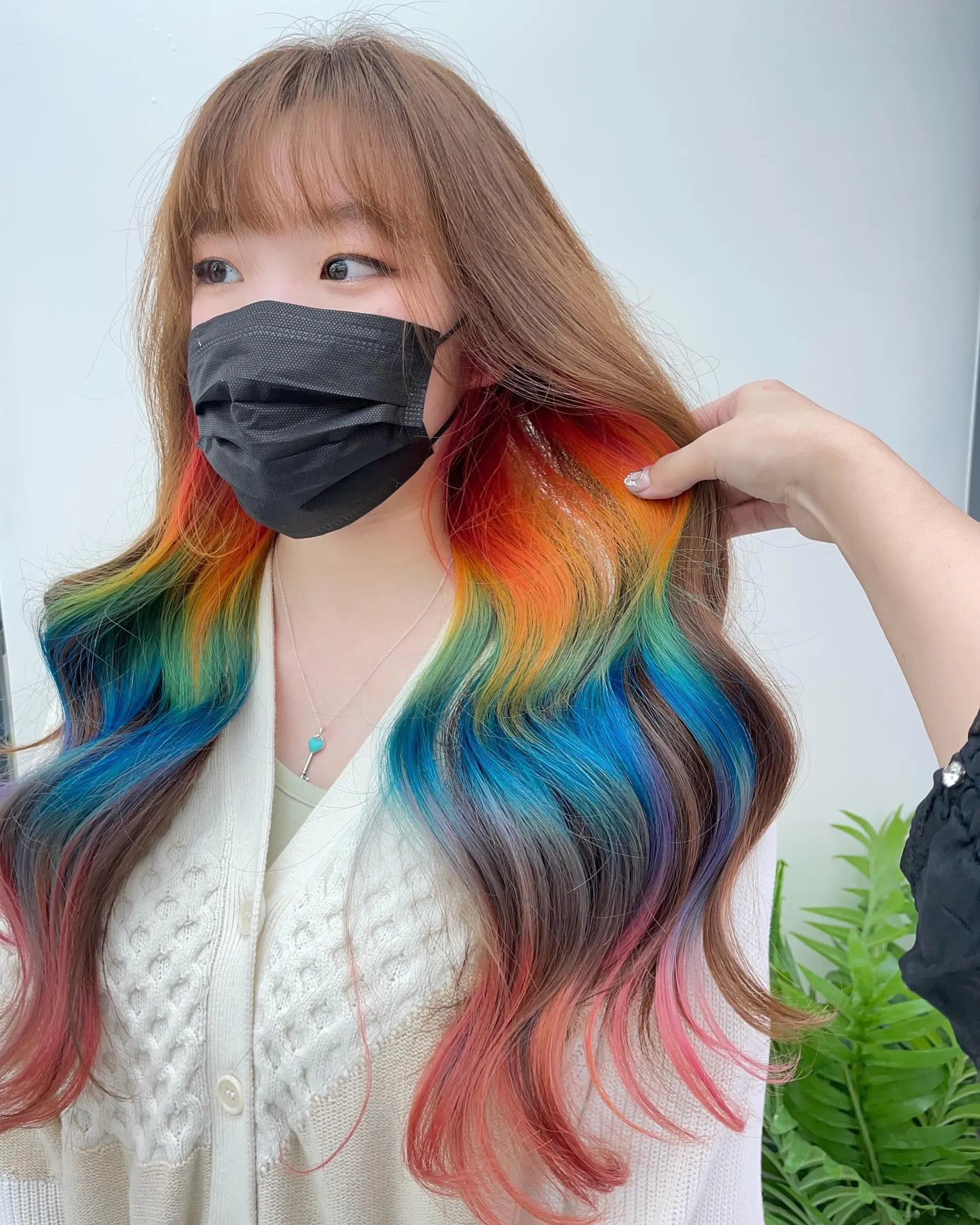 Long, straight hair with rainbow-colored dip-dyed ends, styled into soft waves. 1