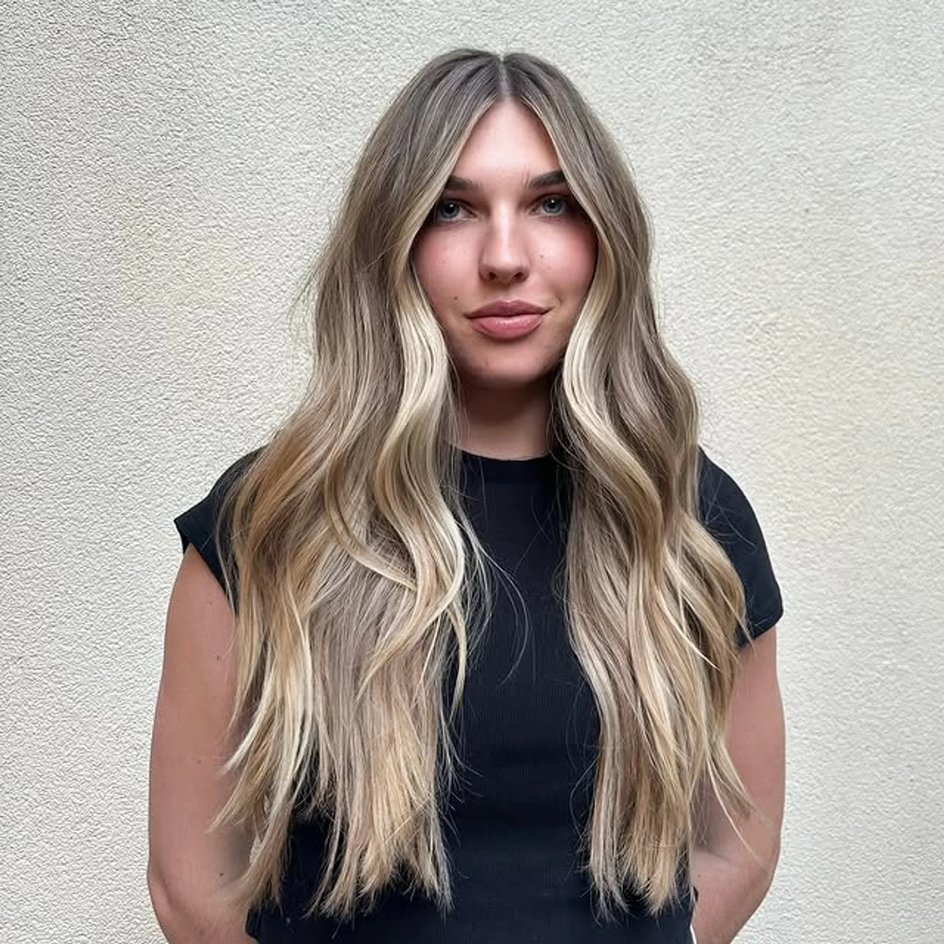 Long, wavy hair with a stunning blonde balayage, creating a dimensional and beachy look. - Preview 1