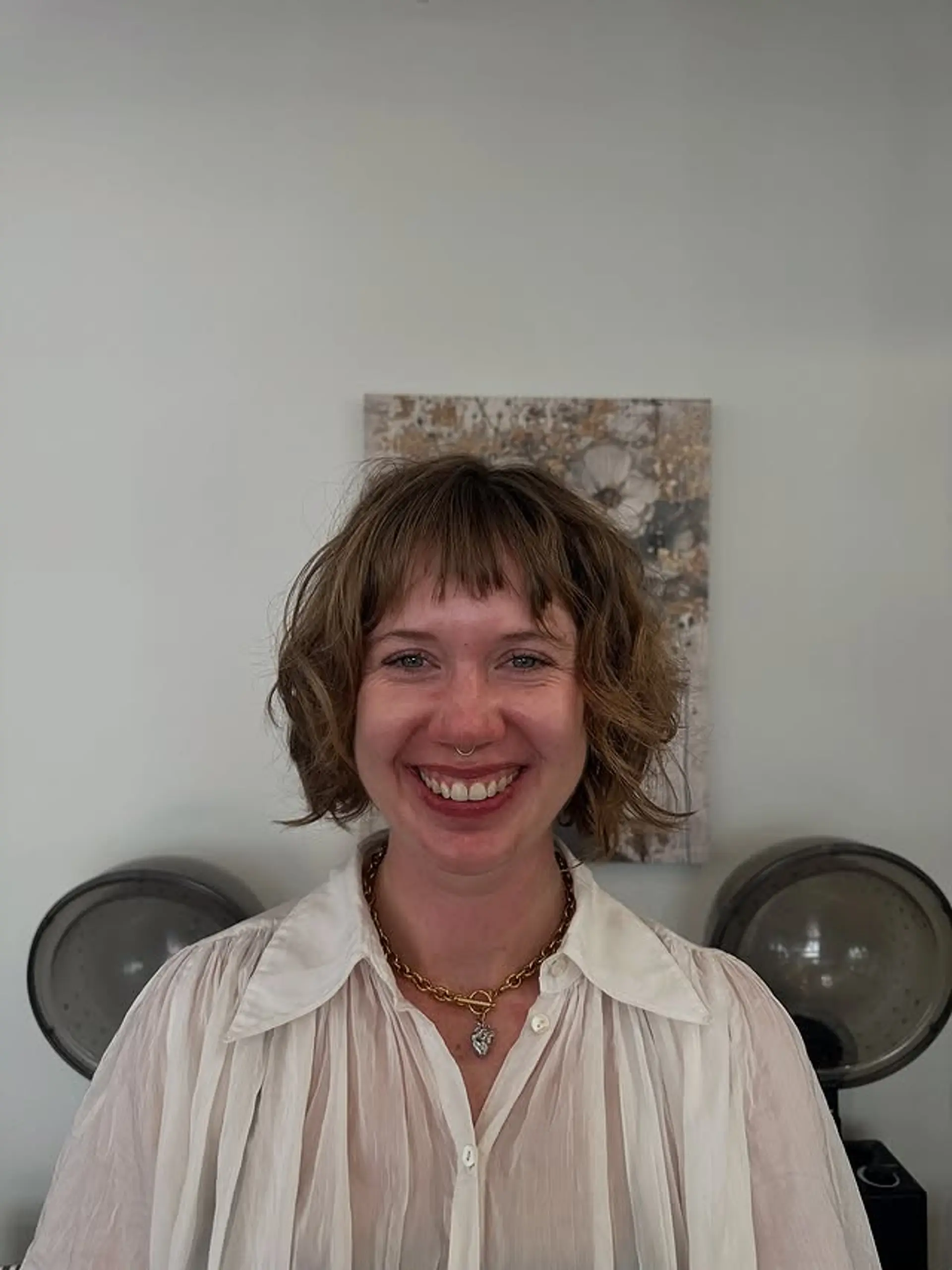 A modern wavy bob with short, stylish baby bangs. 1