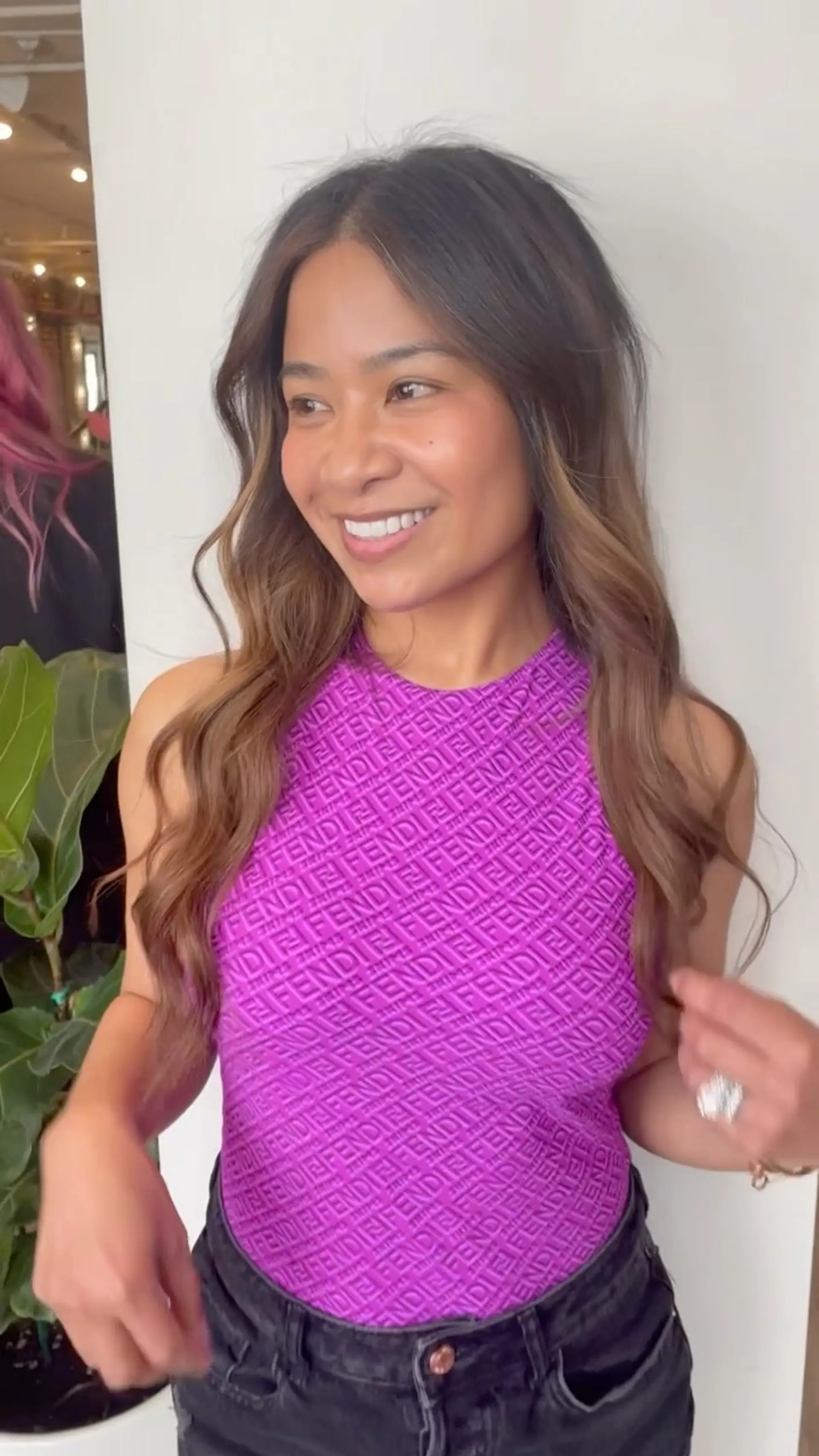Long brunette hair with warm caramel balayage styled in soft, loose waves. 1