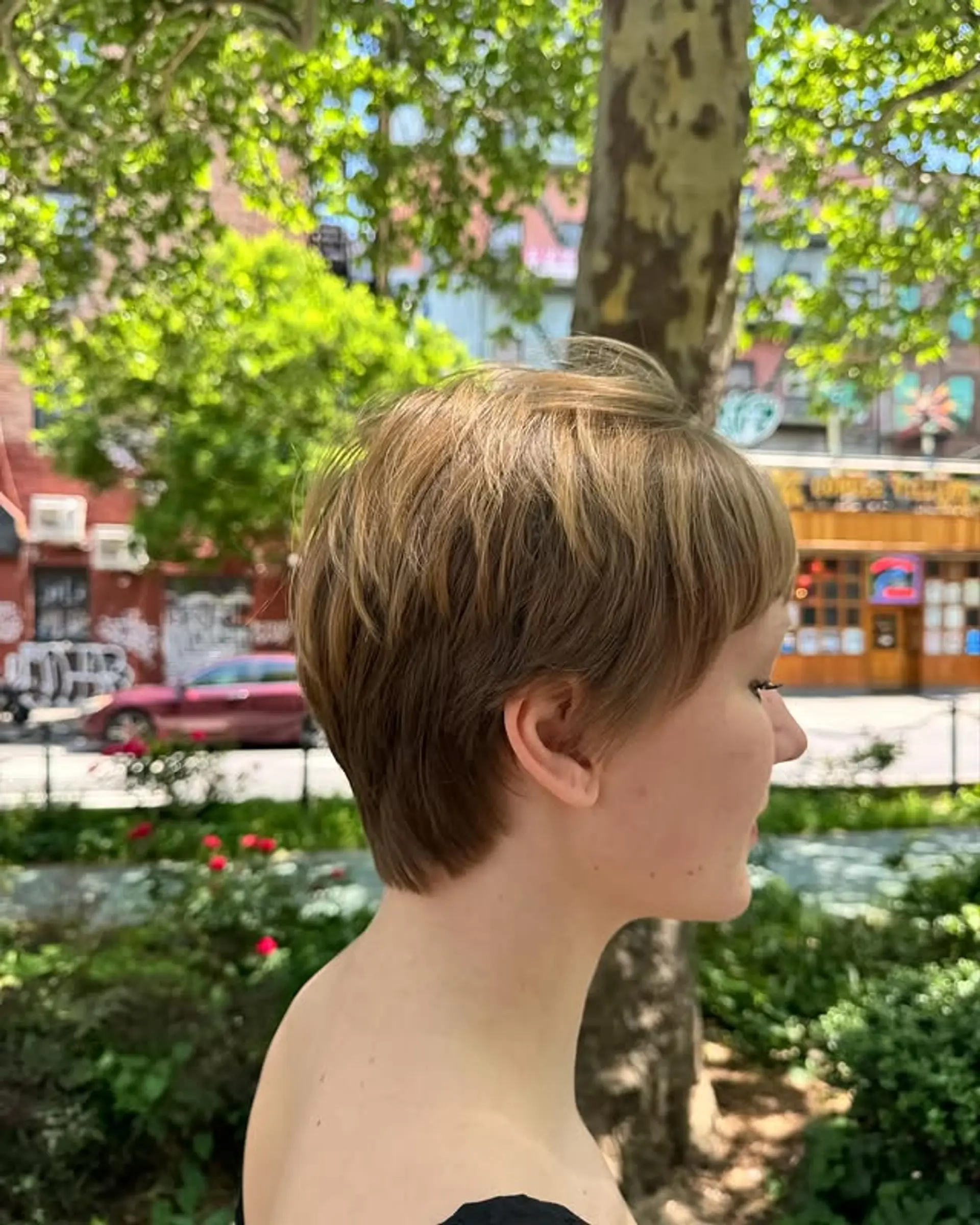 A short pixie cut featuring textured bangs and choppy layers for an edgy and modern style. 1