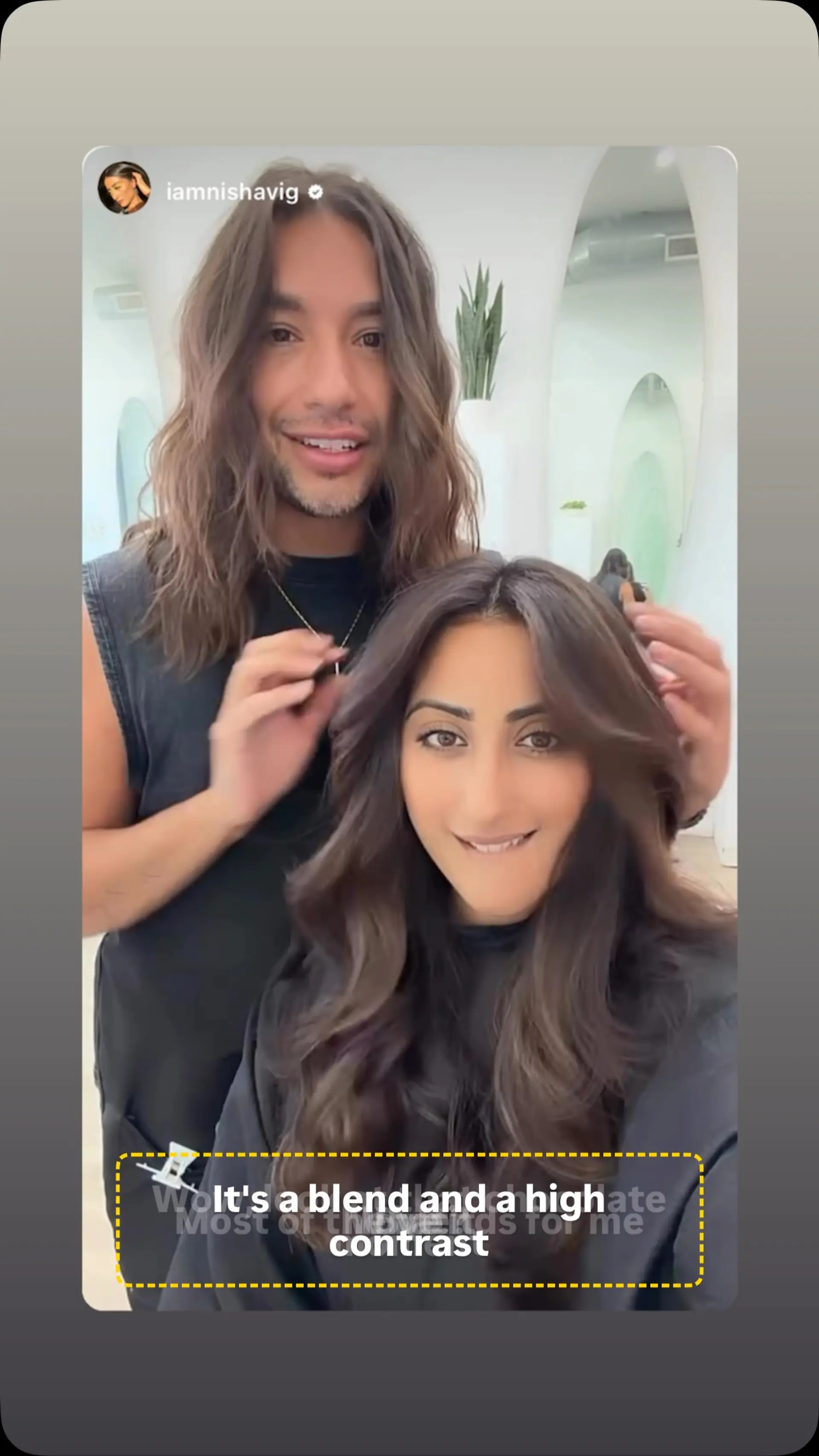 Long chocolate brown hair styled with bouncy, voluminous waves and soft face-framing layers. 1