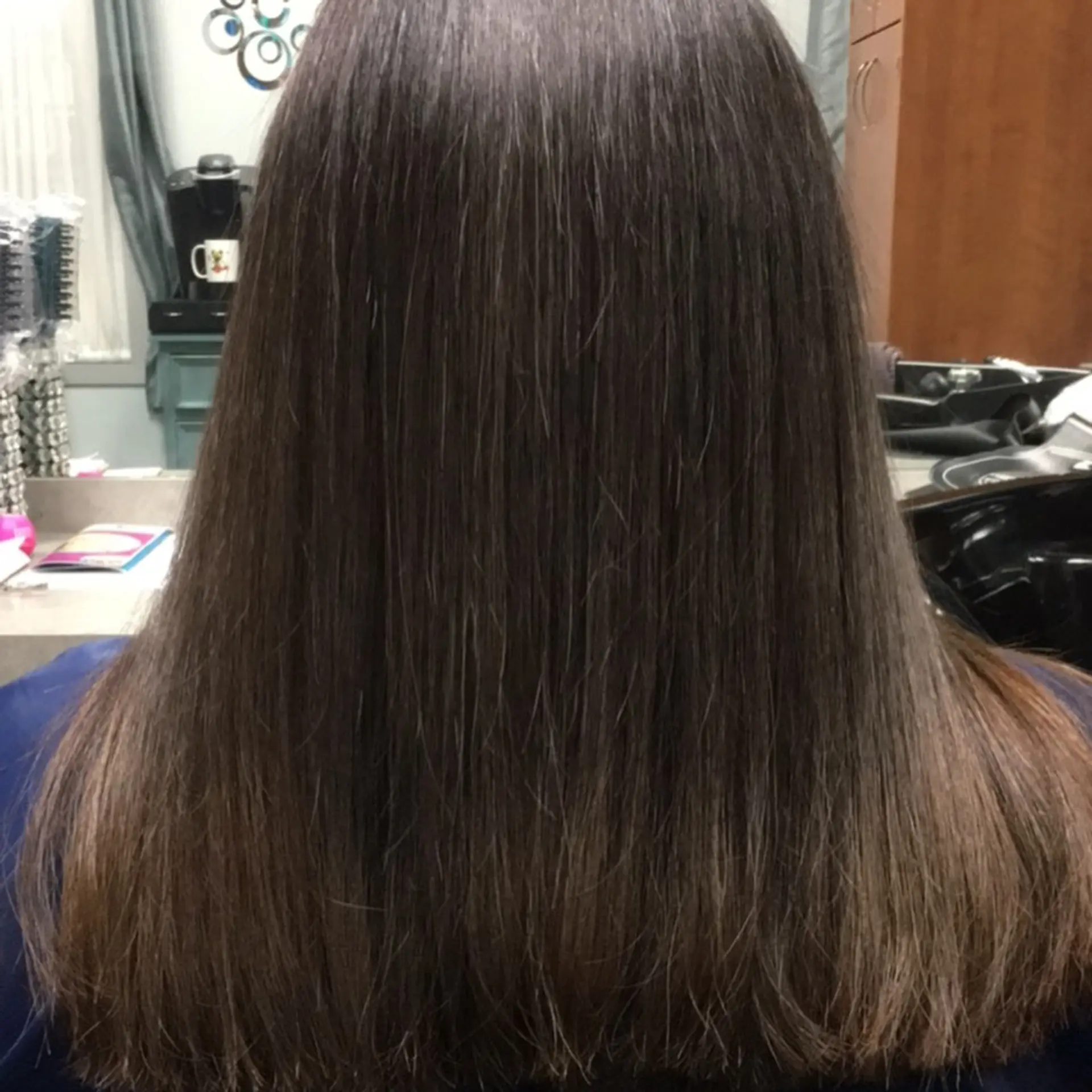 A sleek, pin-straight long hairstyle featuring a full, blunt-cut perimeter and a smooth, glossy finish. 1