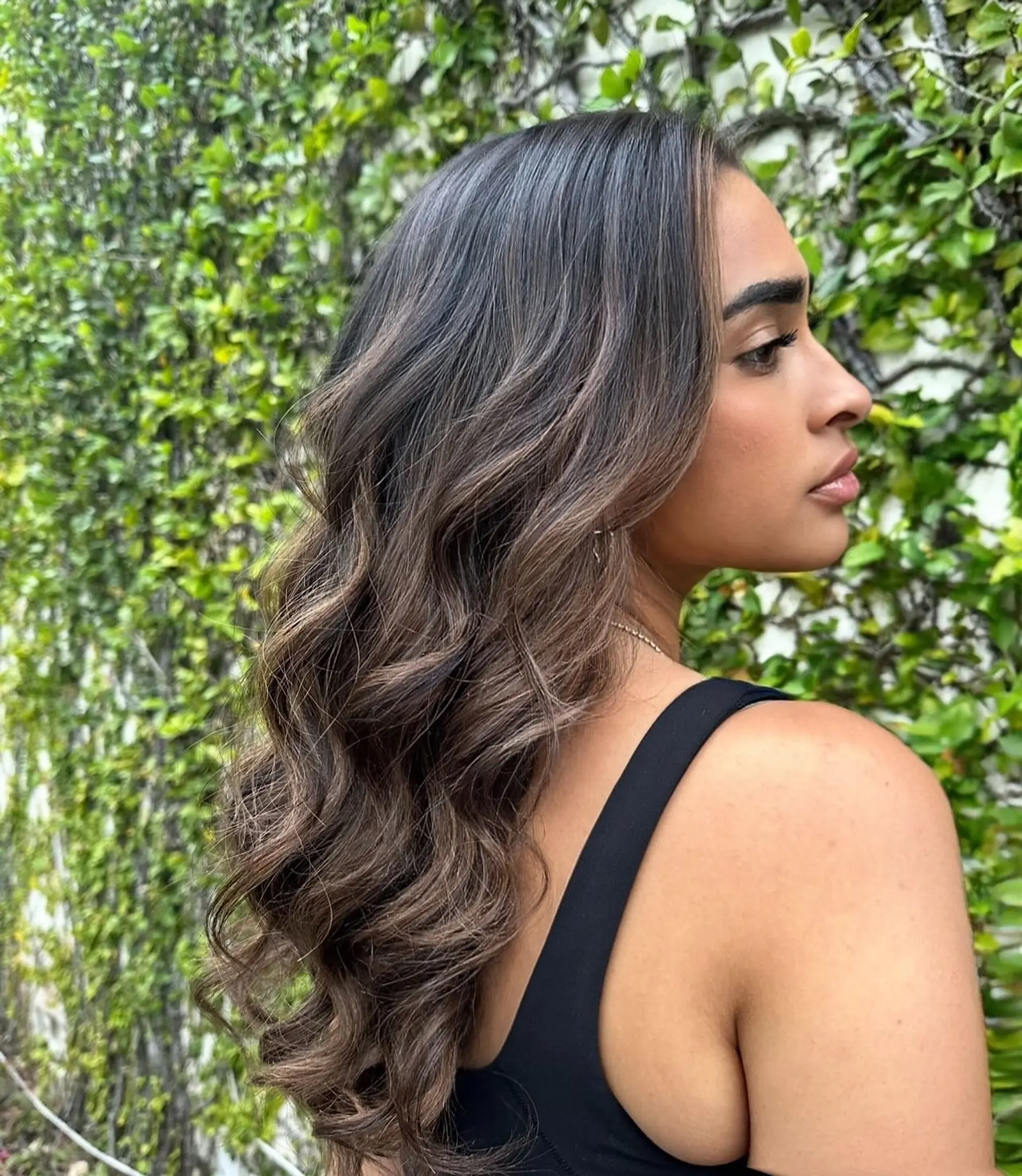 Long, wavy hair with caramel ribbon highlights. 1