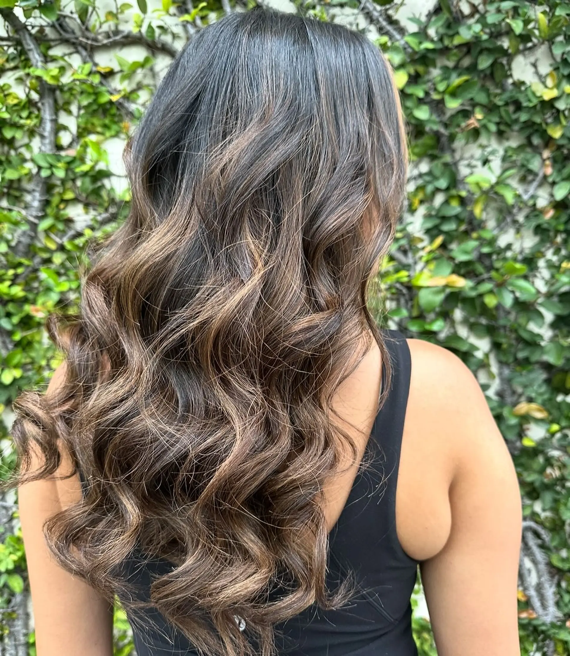 Long, wavy hair with caramel ribbon highlights. 2