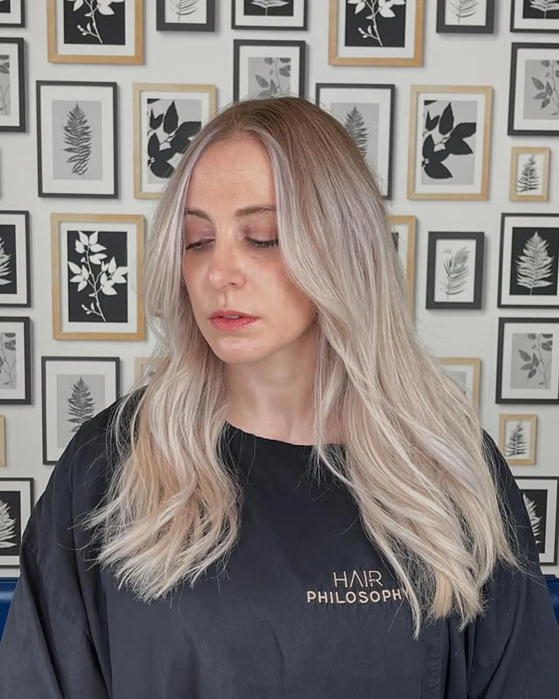 Long, layered haircut with face-framing layers and dimensional coloring. 1