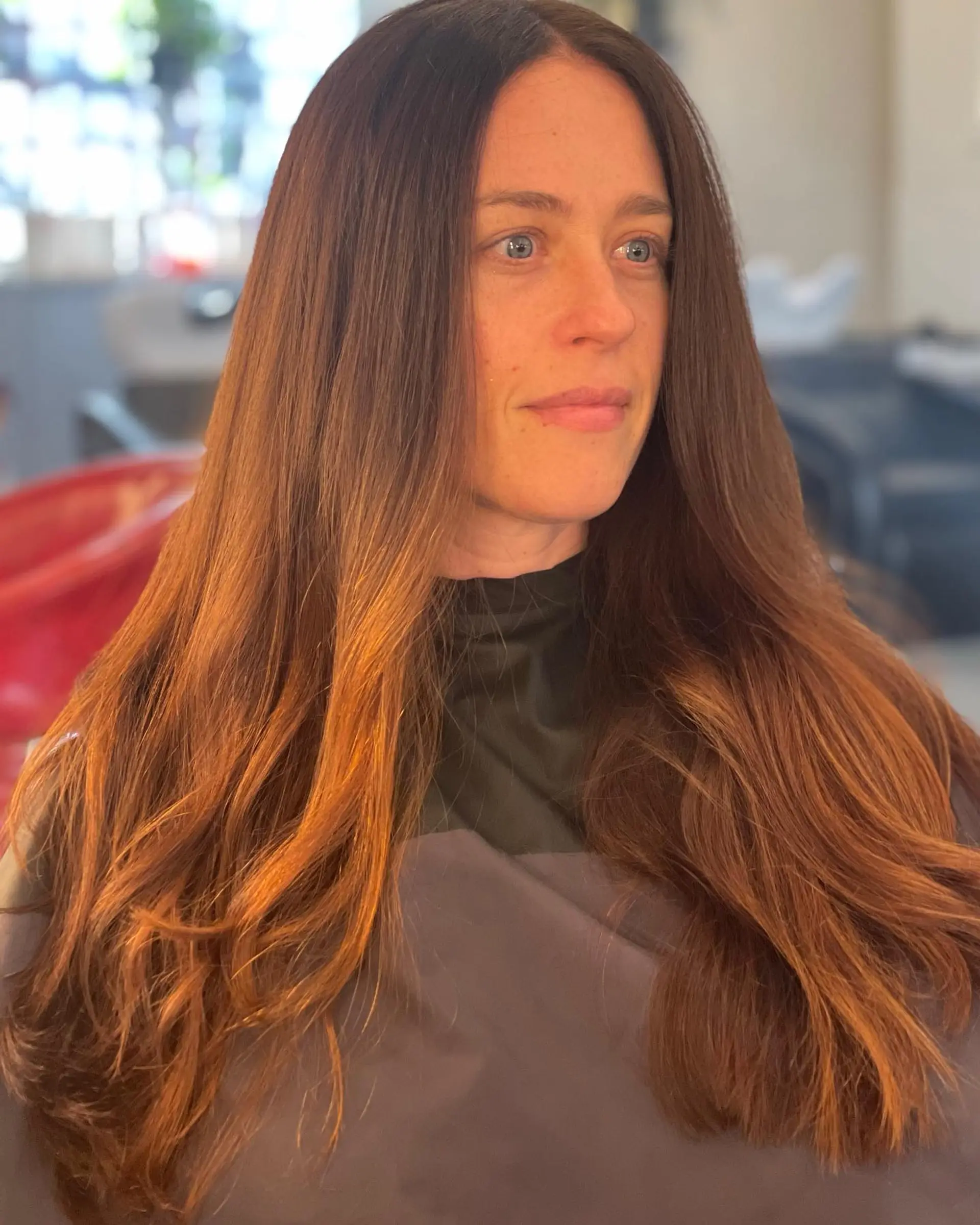 Long layered hair with a warm caramel balayage. 1