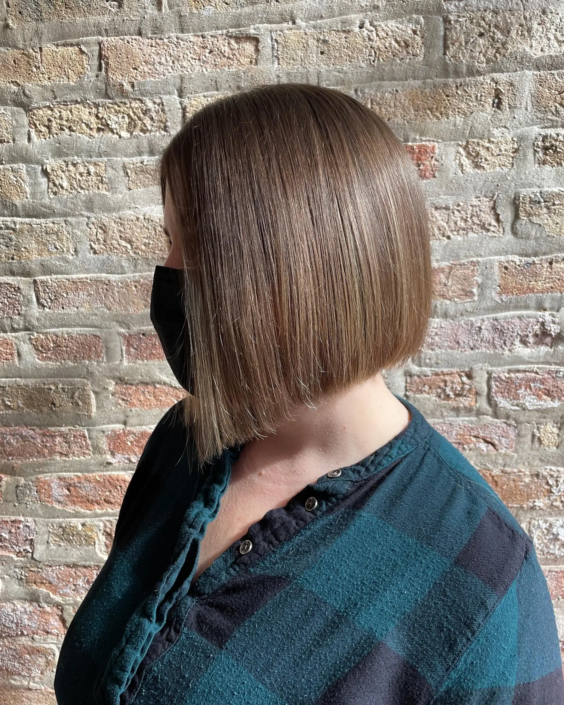 A chic, straight blunt bob cut to chin length. 1
