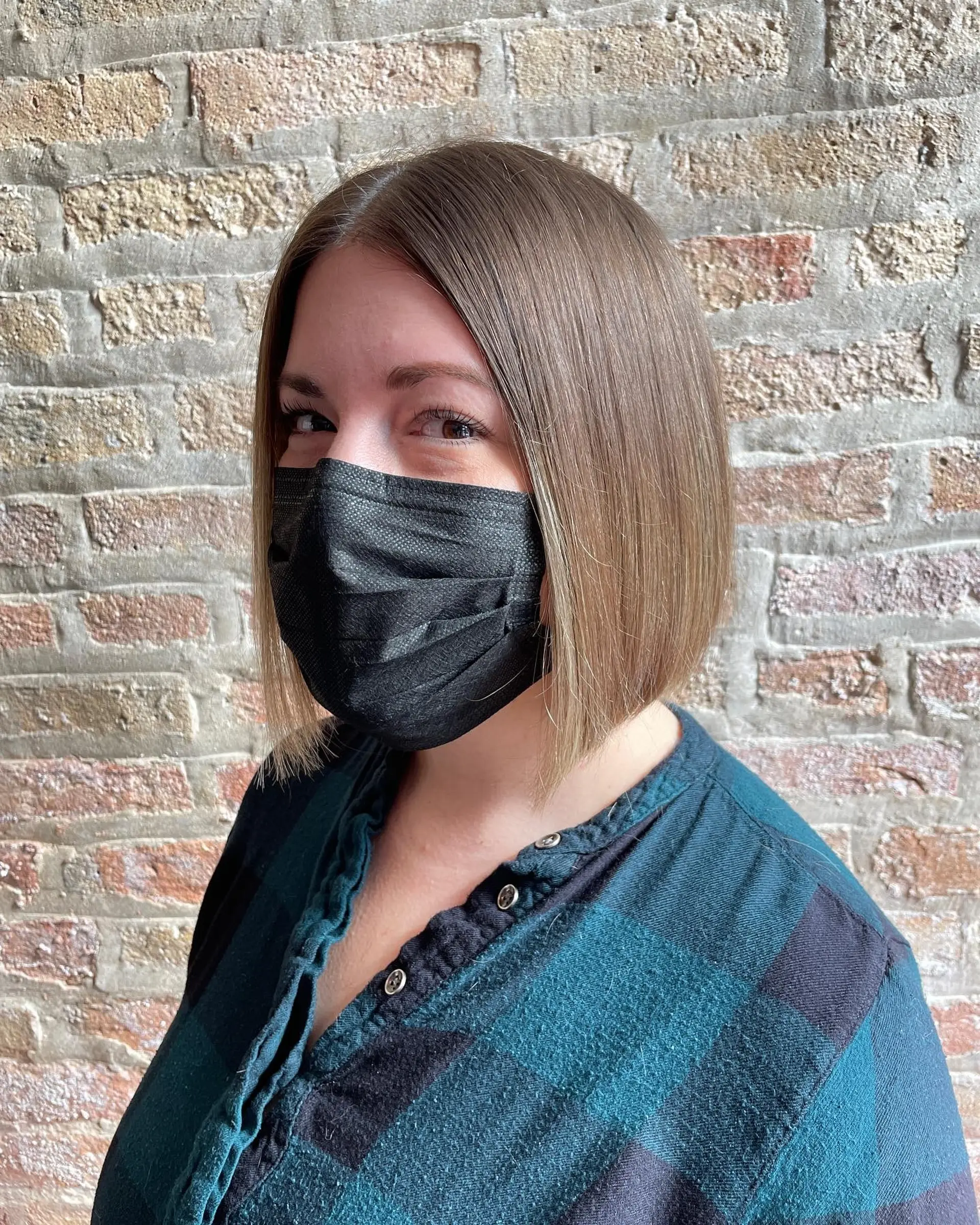 A chic, straight blunt bob cut to chin length. 2