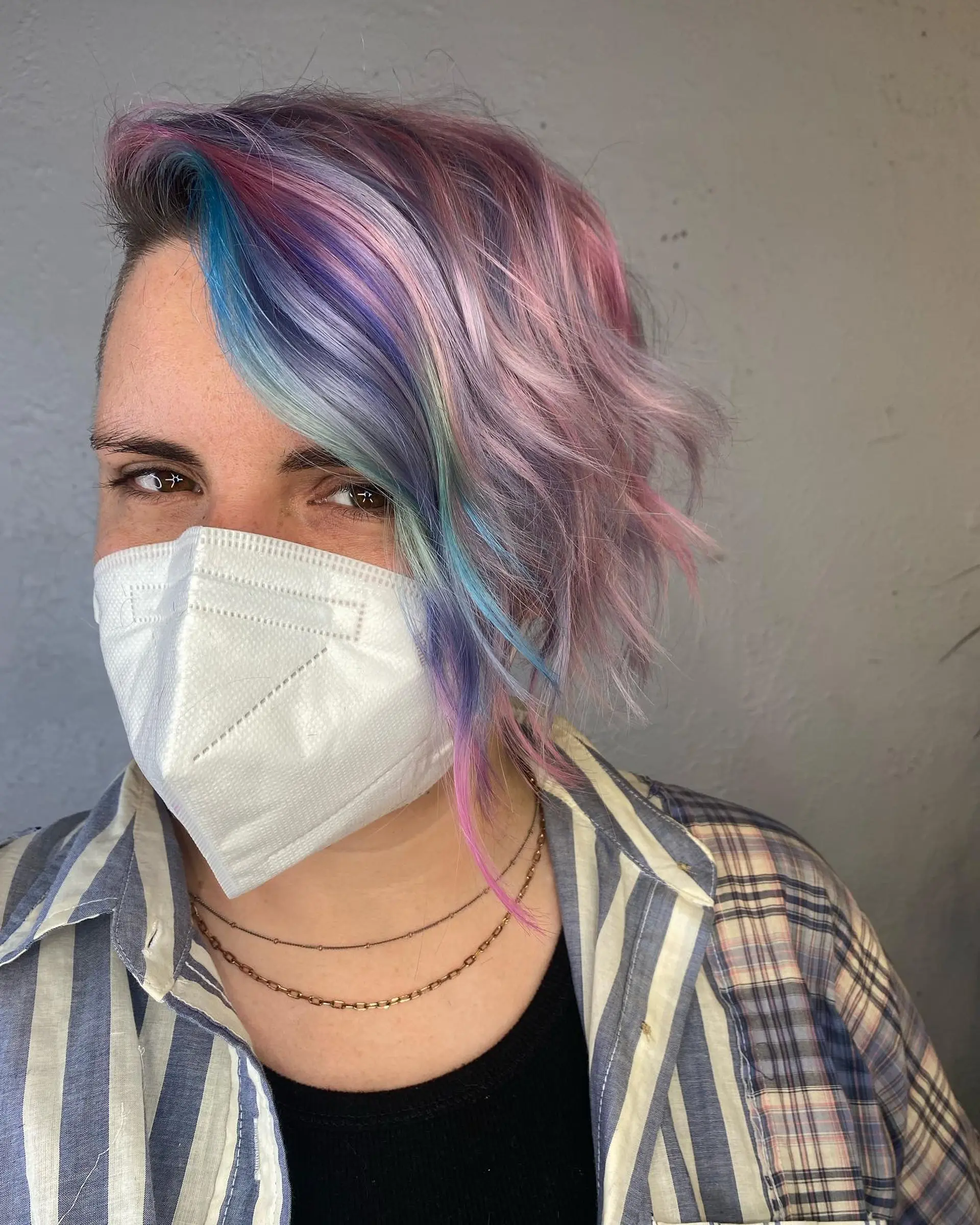 Short, wavy pixie cut with a rainbow pastel color palette. 1