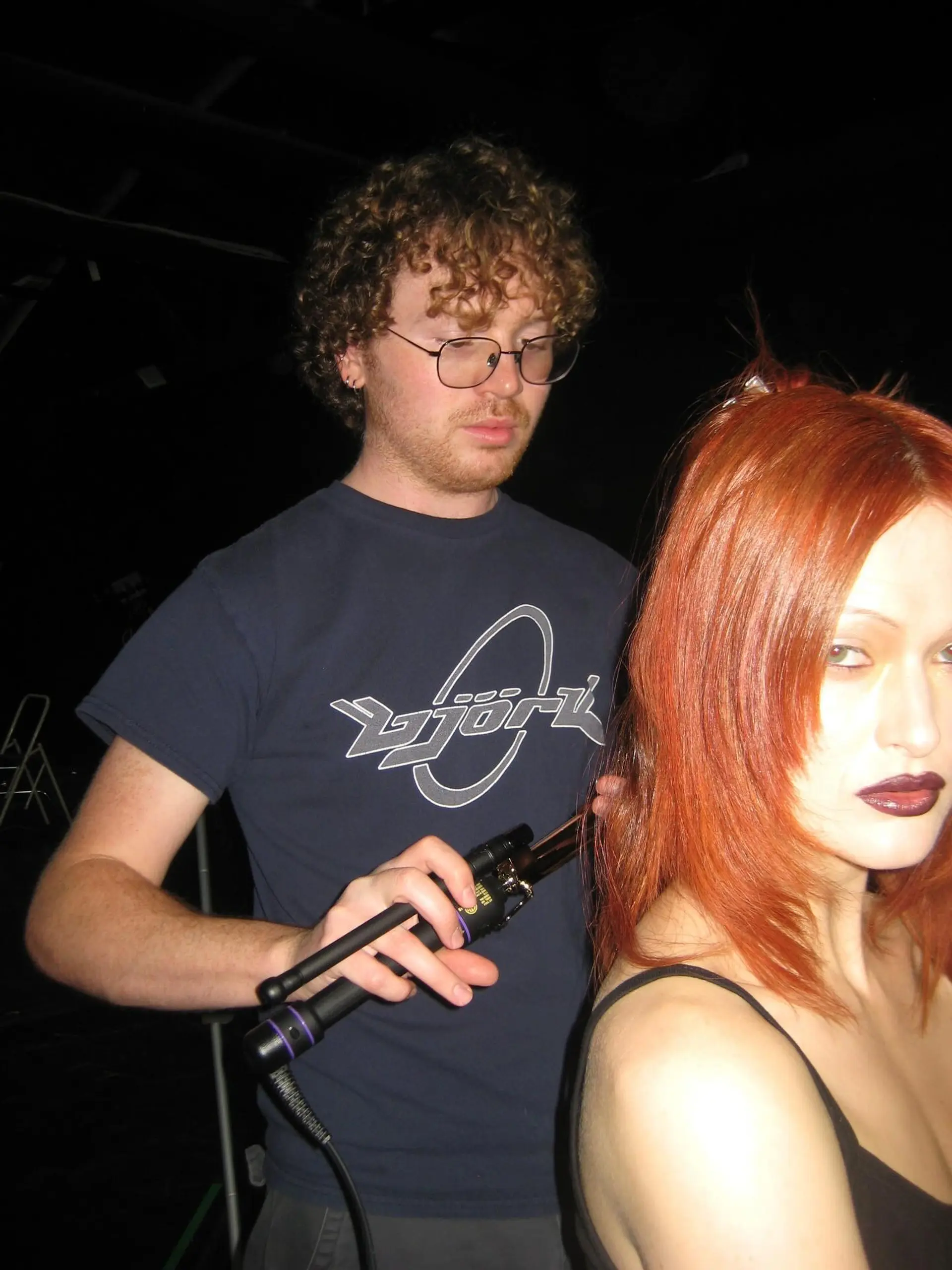 Medium-length bright copper red haircut featuring layered ends and face-framing pieces. 1