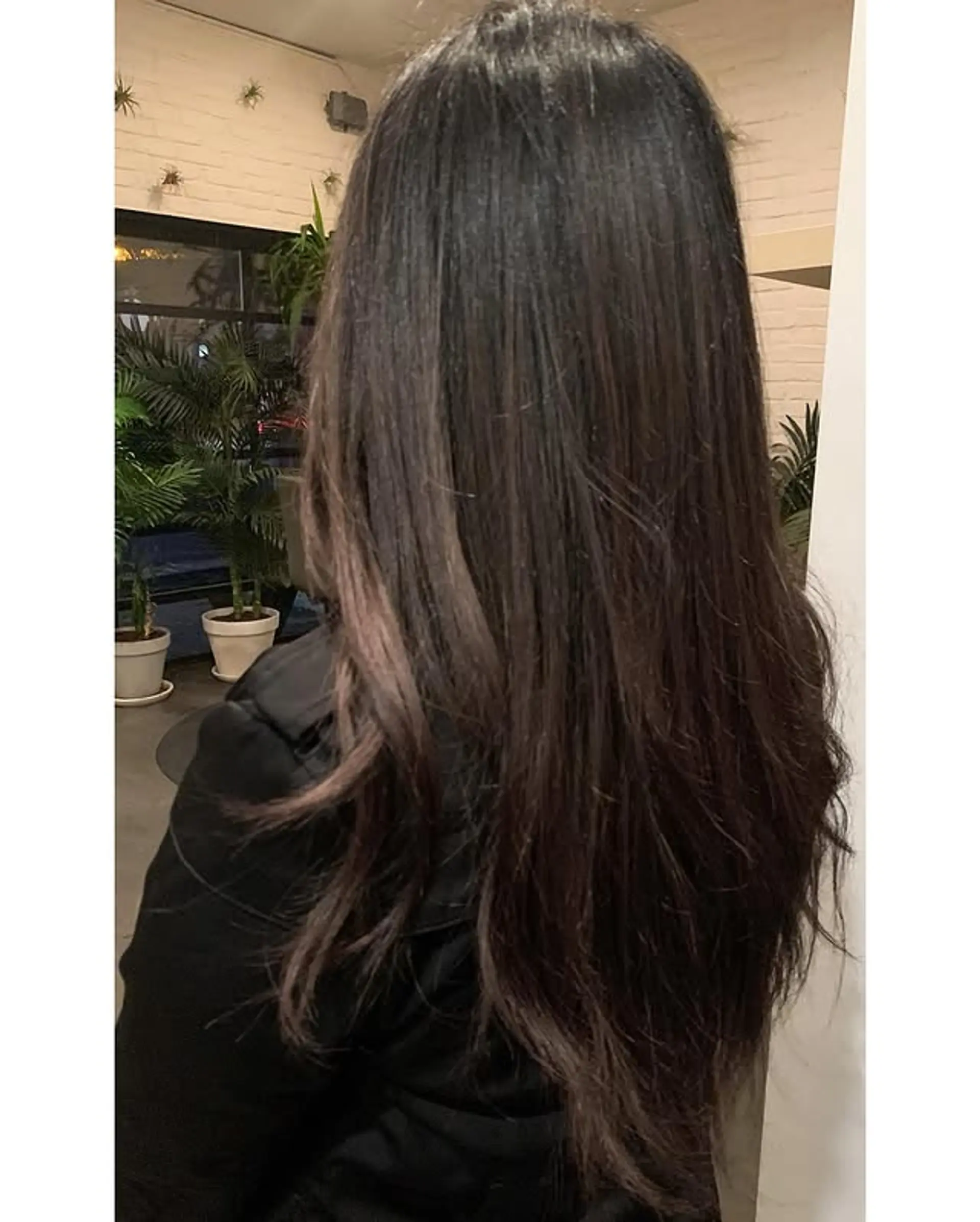 Long, straight hair with subtle layers and a brunette balayage. 1